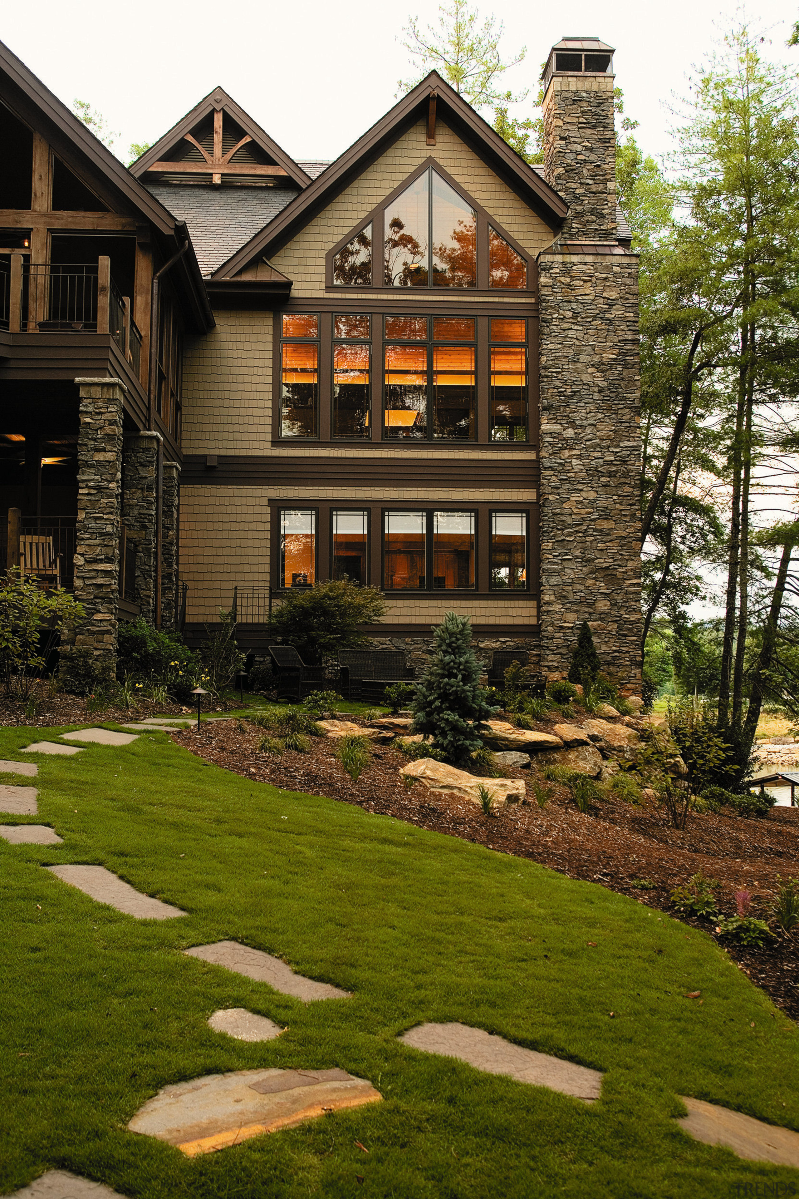 Exterior view of two storey stone and weatherboard backyard, cottage, estate, facade, farmhouse, grass, home, house, landscape, landscaping, lawn, neighbourhood, plant, property, real estate, residential area, siding, walkway, window, yard, brown