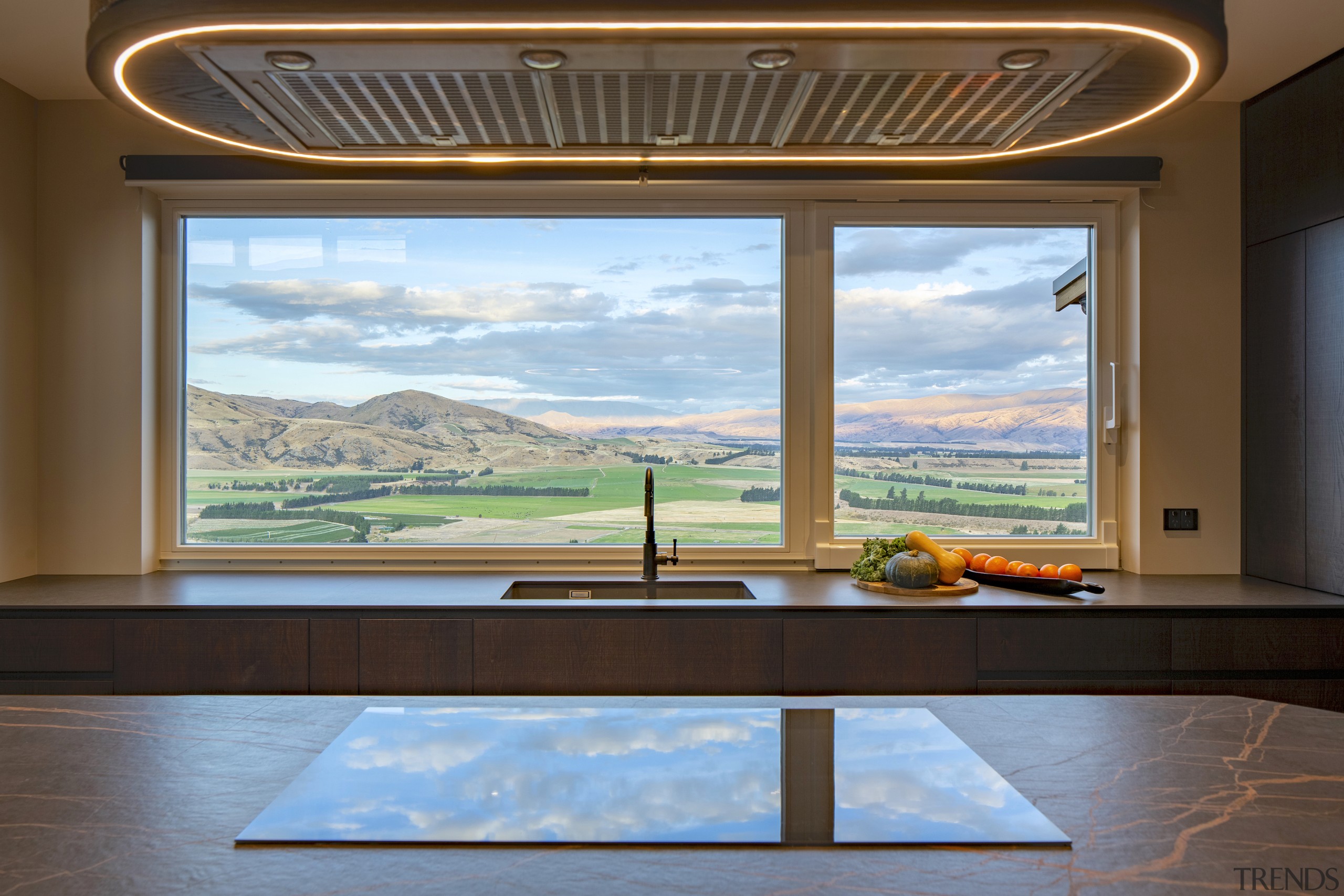 Even the cooktop reflects the clouds in this 