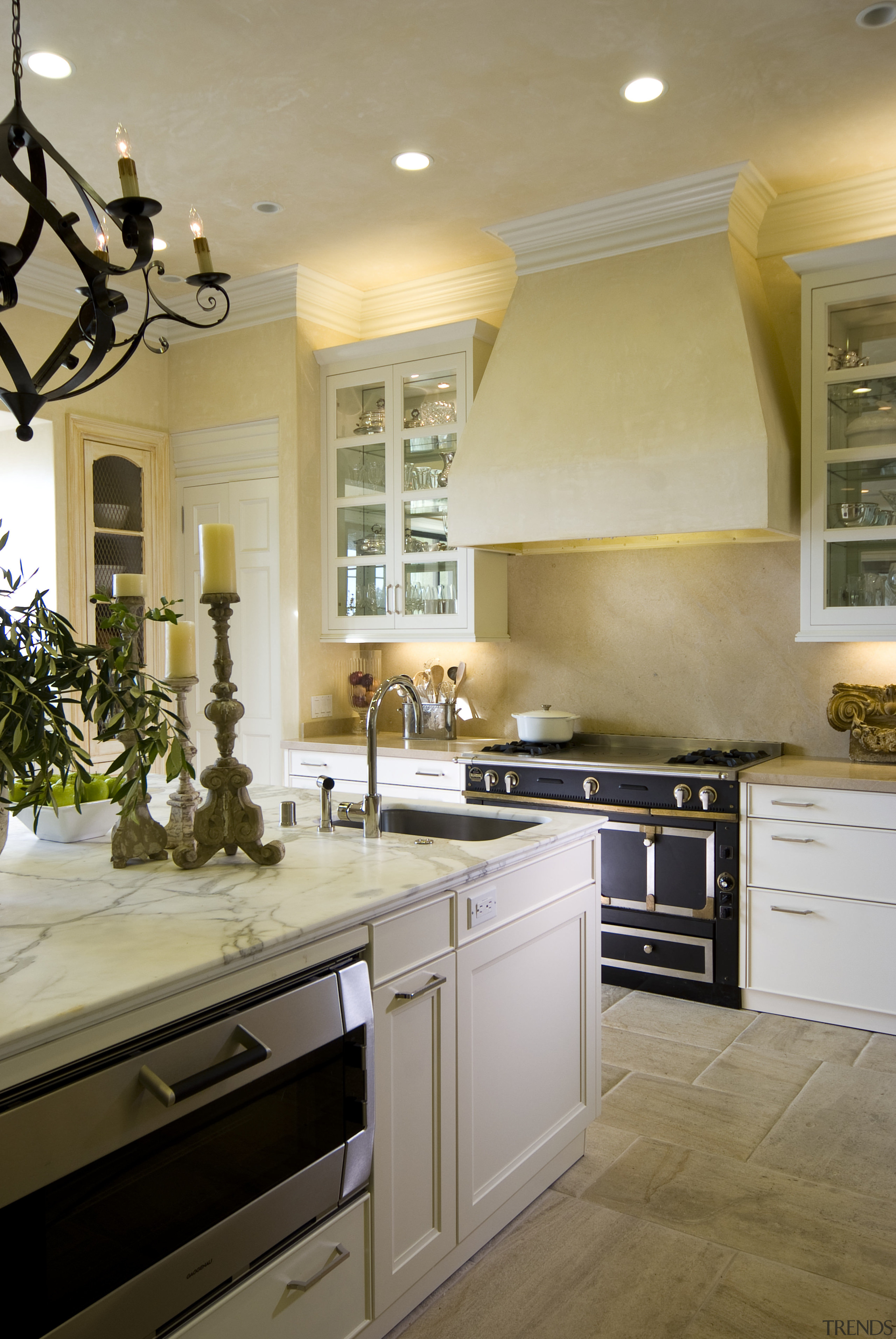 View of kitchen with warm toned walls and cabinetry, ceiling, countertop, cuisine classique, floor, home, interior design, kitchen, room, brown, gray