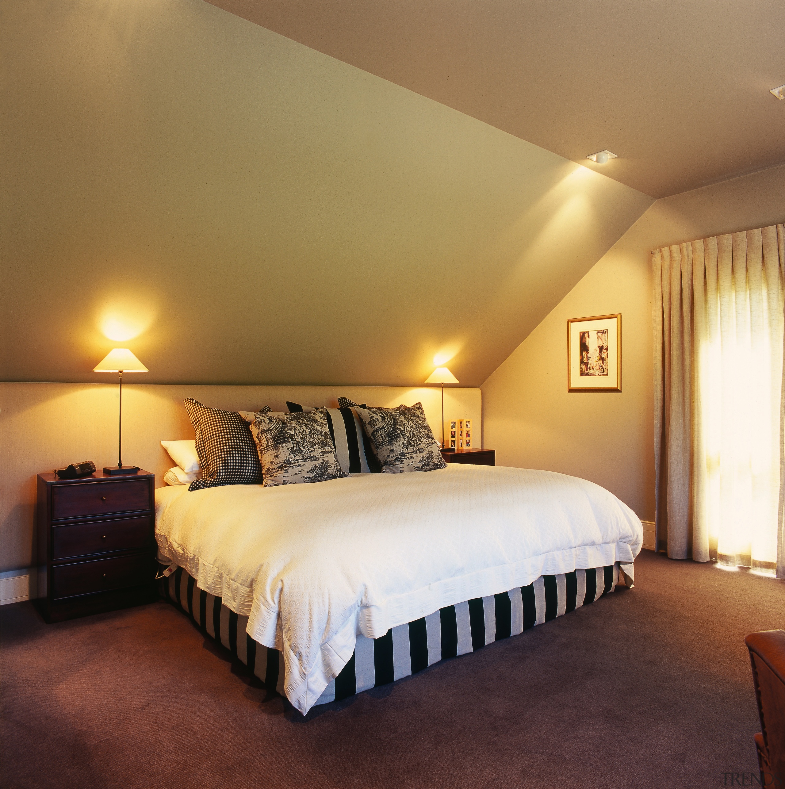 A view of a bedroom, brown carpet, white bed, bed frame, bedroom, ceiling, estate, floor, home, interior design, lighting, real estate, room, suite, wall, brown