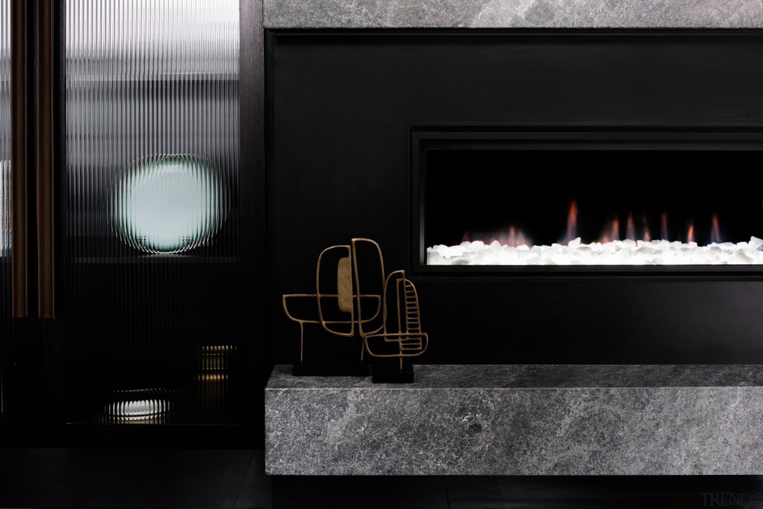 A fireplace draws the eye in this lounge fireplace, hearth, interior design, black