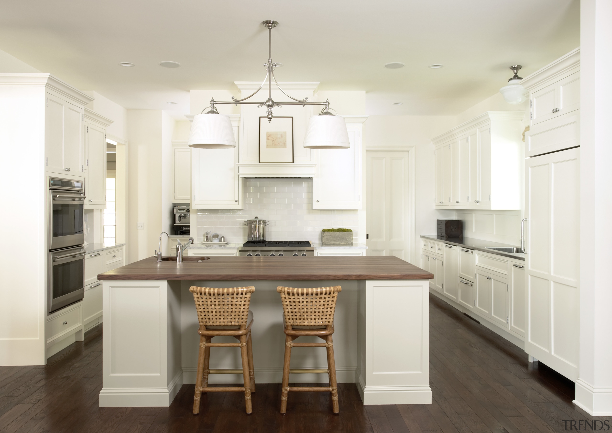 The kitchen is in a traditional, clean style, cabinetry, ceiling, countertop, cuisine classique, floor, flooring, hardwood, interior design, kitchen, laminate flooring, room, wood flooring, white