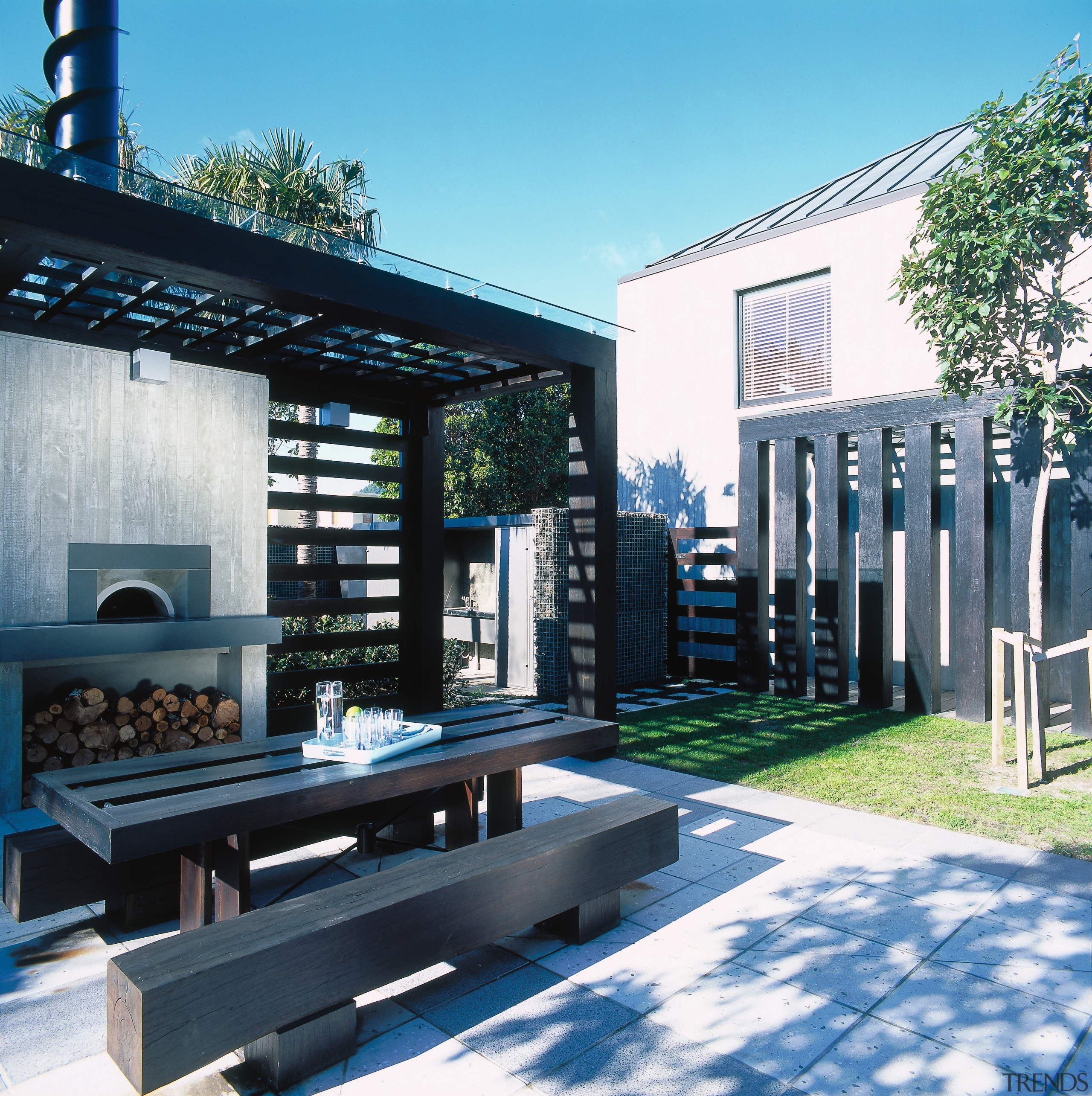 view of the outdoor eating area which features architecture, house, teal, black