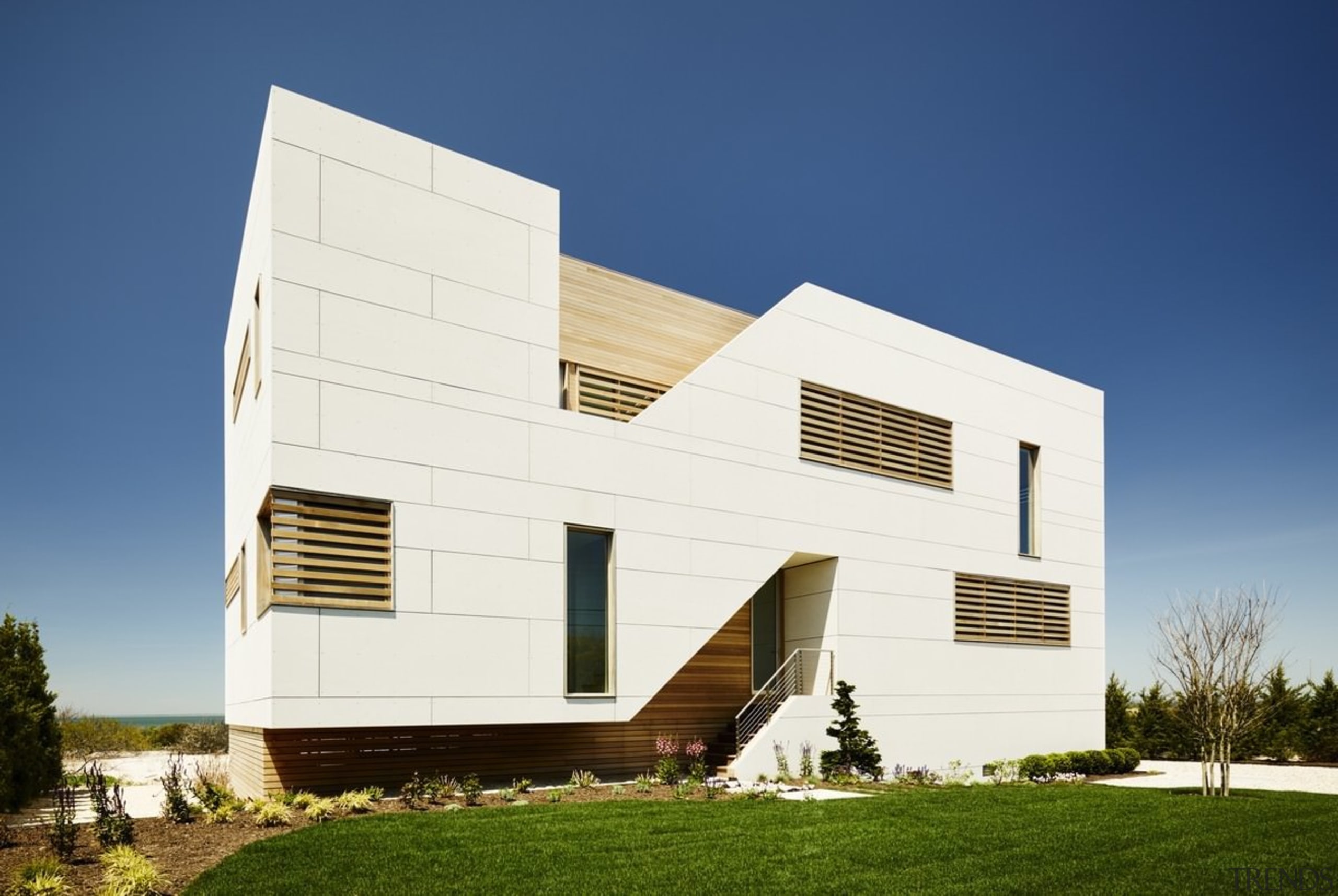 The home has a distinctive look - The architecture, building, corporate headquarters, elevation, facade, home, house, real estate, residential area, siding, sky, blue, white