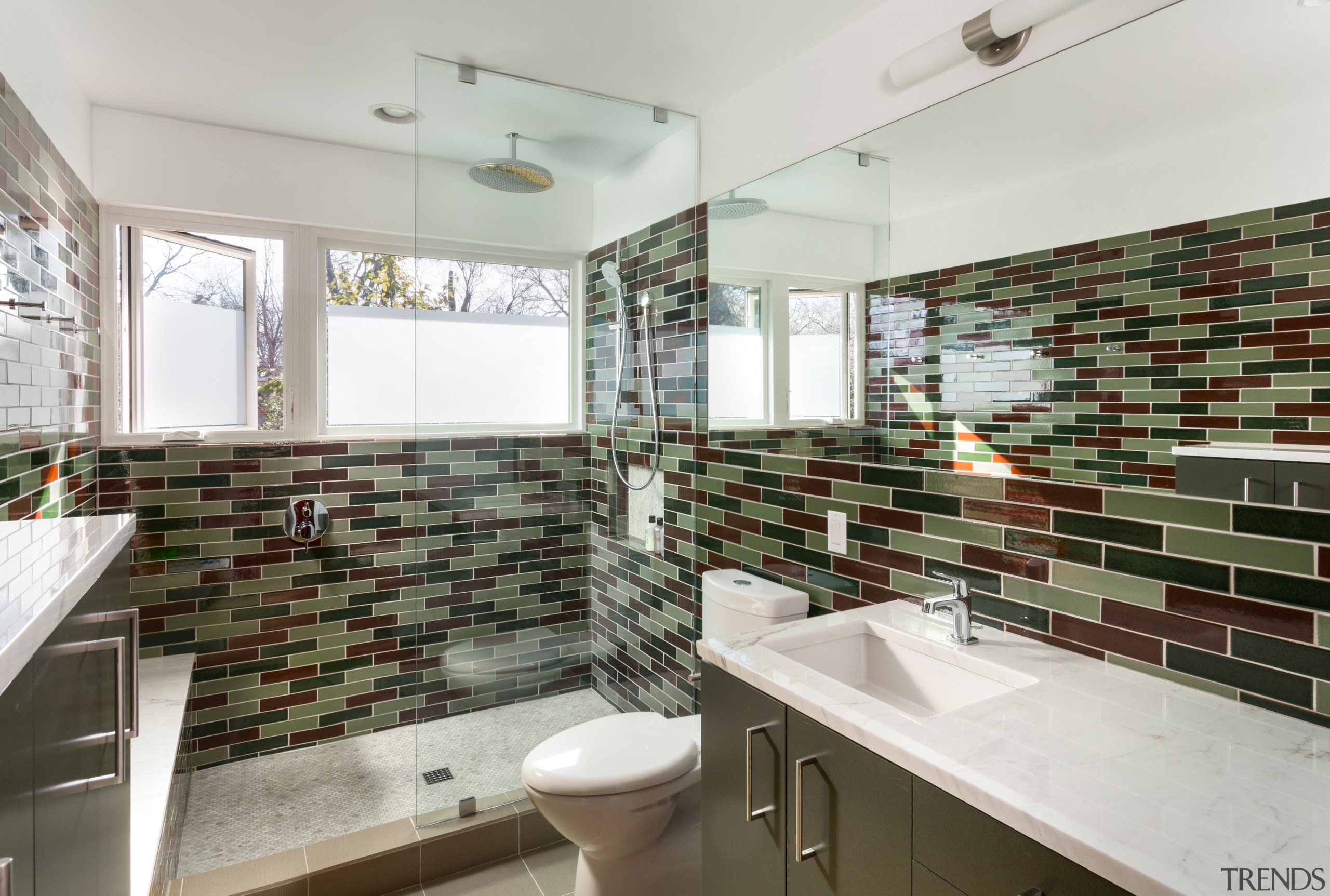 Windows were added to this remodeled bathroom to bathroom, interior design, property, real estate, room, tile, gray