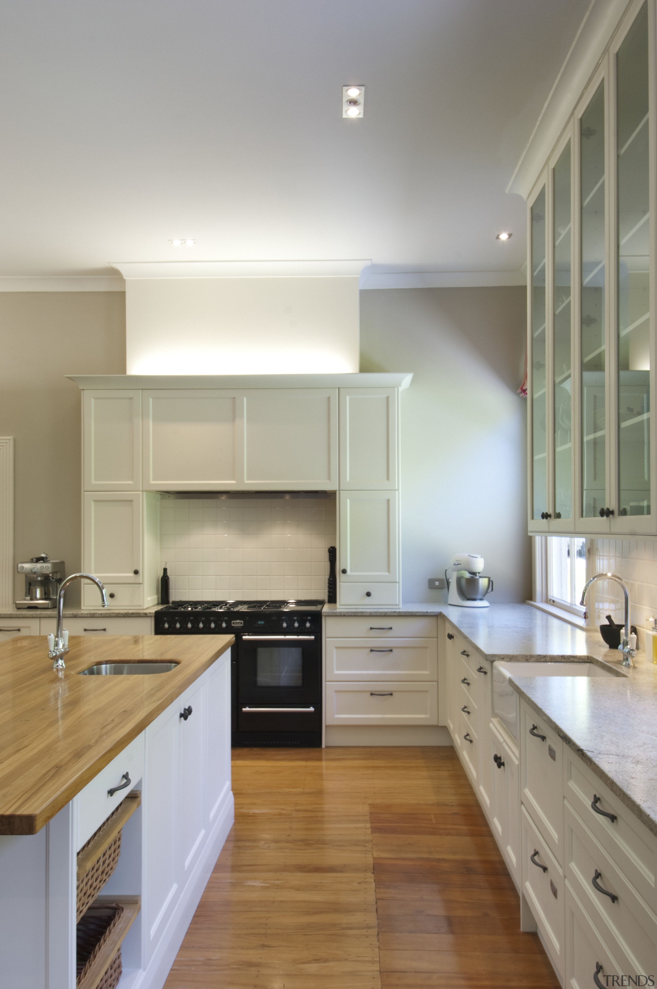 View of contemporary kitchen with wooden flooring and cabinetry, countertop, cuisine classique, floor, flooring, hardwood, home, interior design, kitchen, laminate flooring, real estate, room, wood flooring, gray