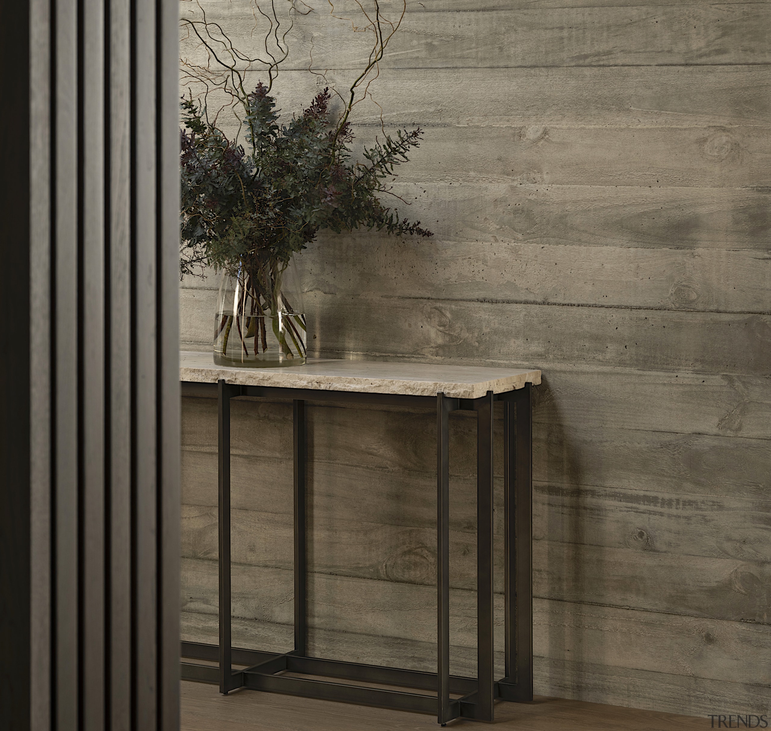 Concrete exterior cladding is continued indoors. 