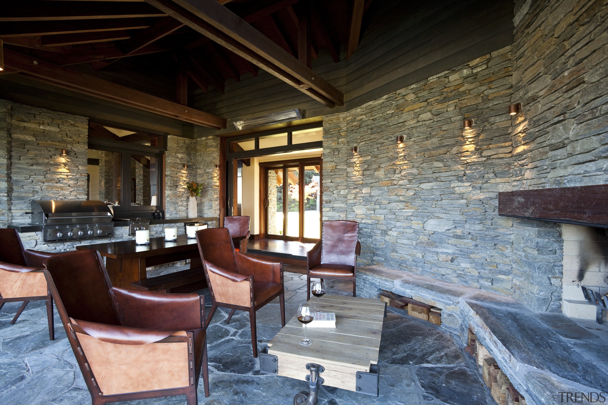 View of lounge area with stone wall feature. interior design, living room, real estate, black