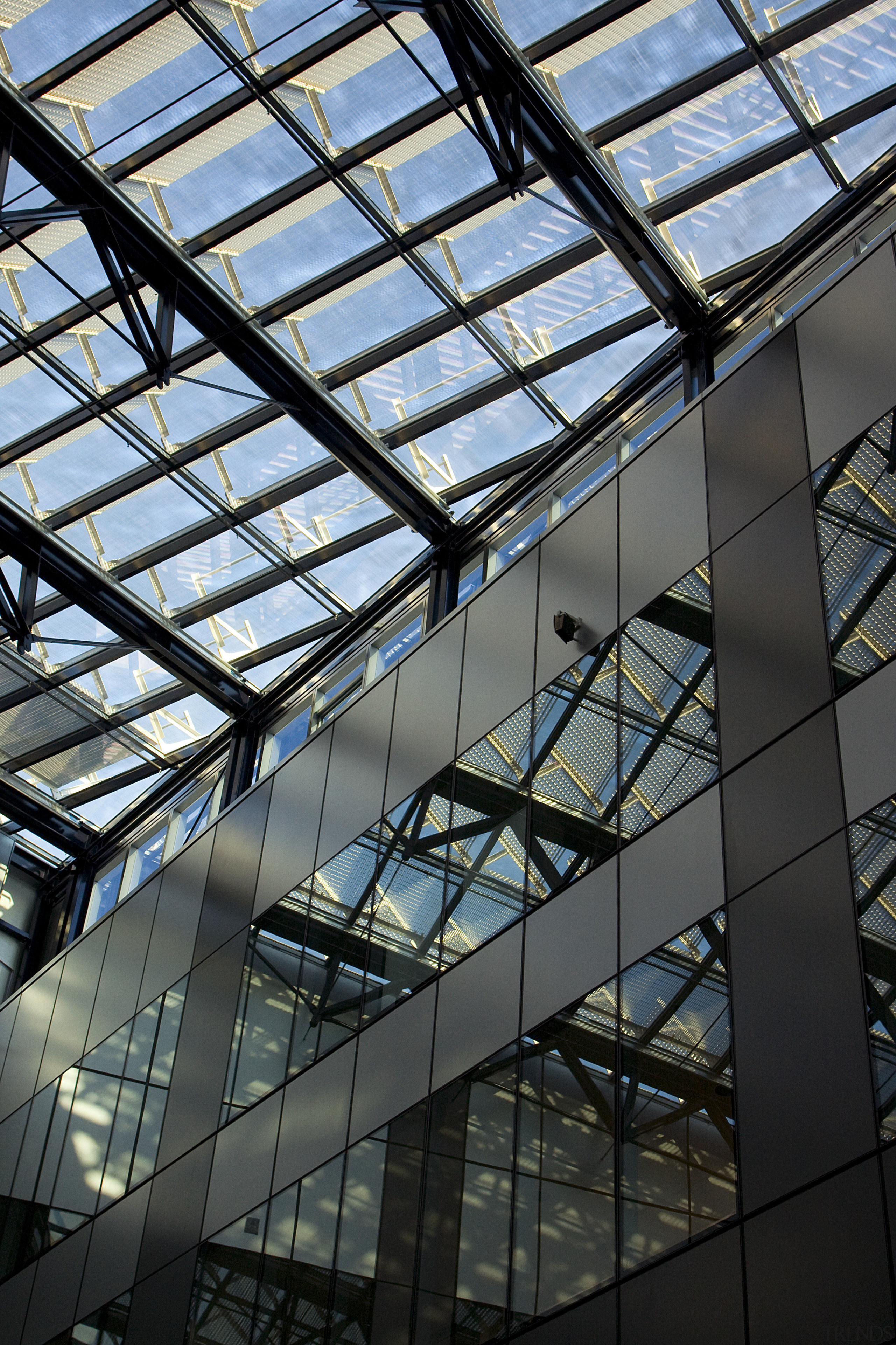 Interior view of an Australian office building which architecture, building, corporate headquarters, daylighting, daytime, facade, glass, headquarters, line, metropolis, metropolitan area, reflection, roof, sky, skyscraper, structure, symmetry, urban area, window, black