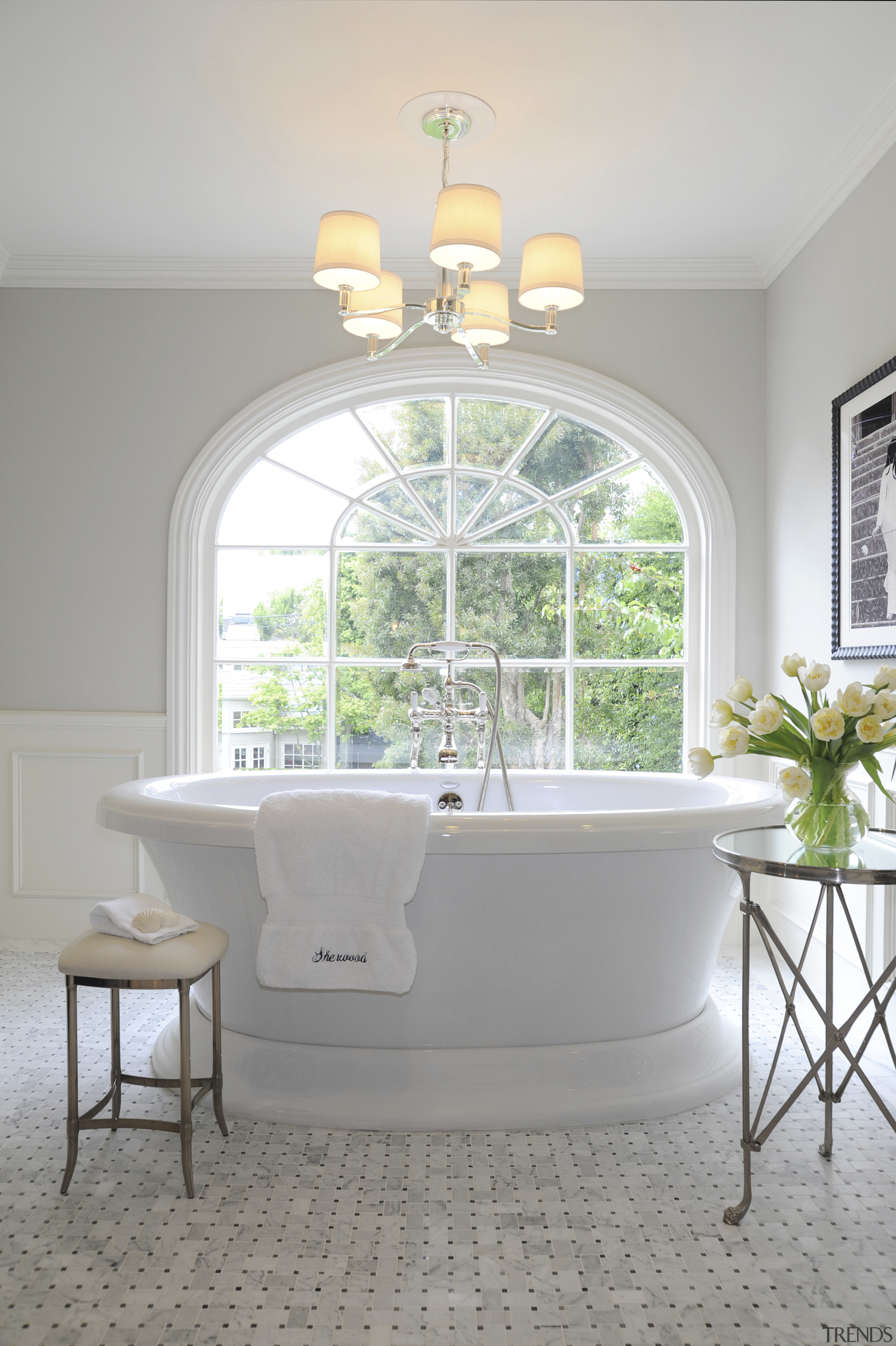 Light toned bathroom with large white tub and bathroom, estate, floor, furniture, home, house, interior design, plumbing fixture, room, sink, table, wall, window, gray