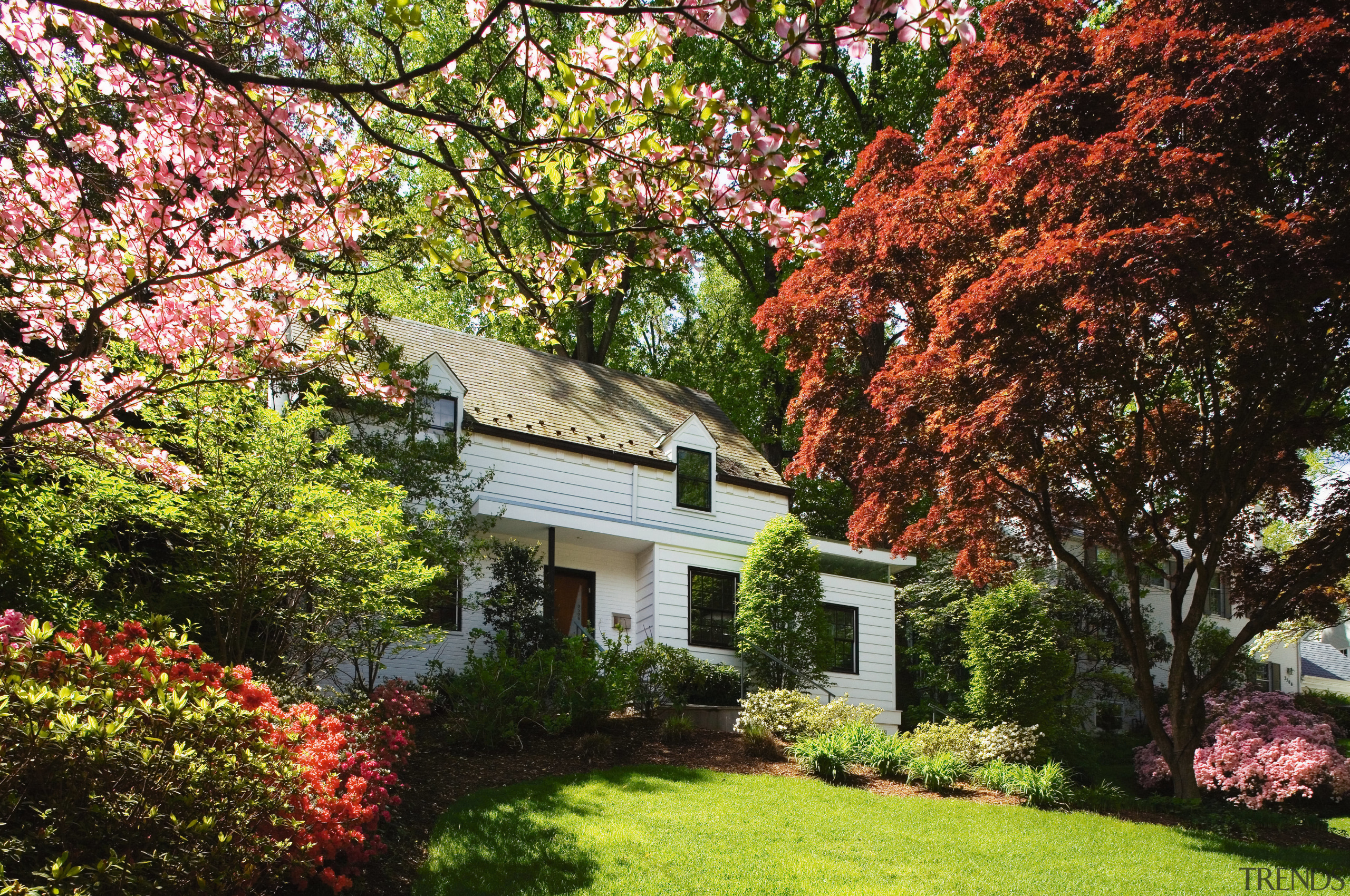 An exterior view of the home. - An autumn, botanical garden, cottage, estate, flower, garden, grass, home, house, landscape, landscaping, lawn, leaf, maple tree, nature, plant, plantation, property, real estate, shrub, spring, tree, brown