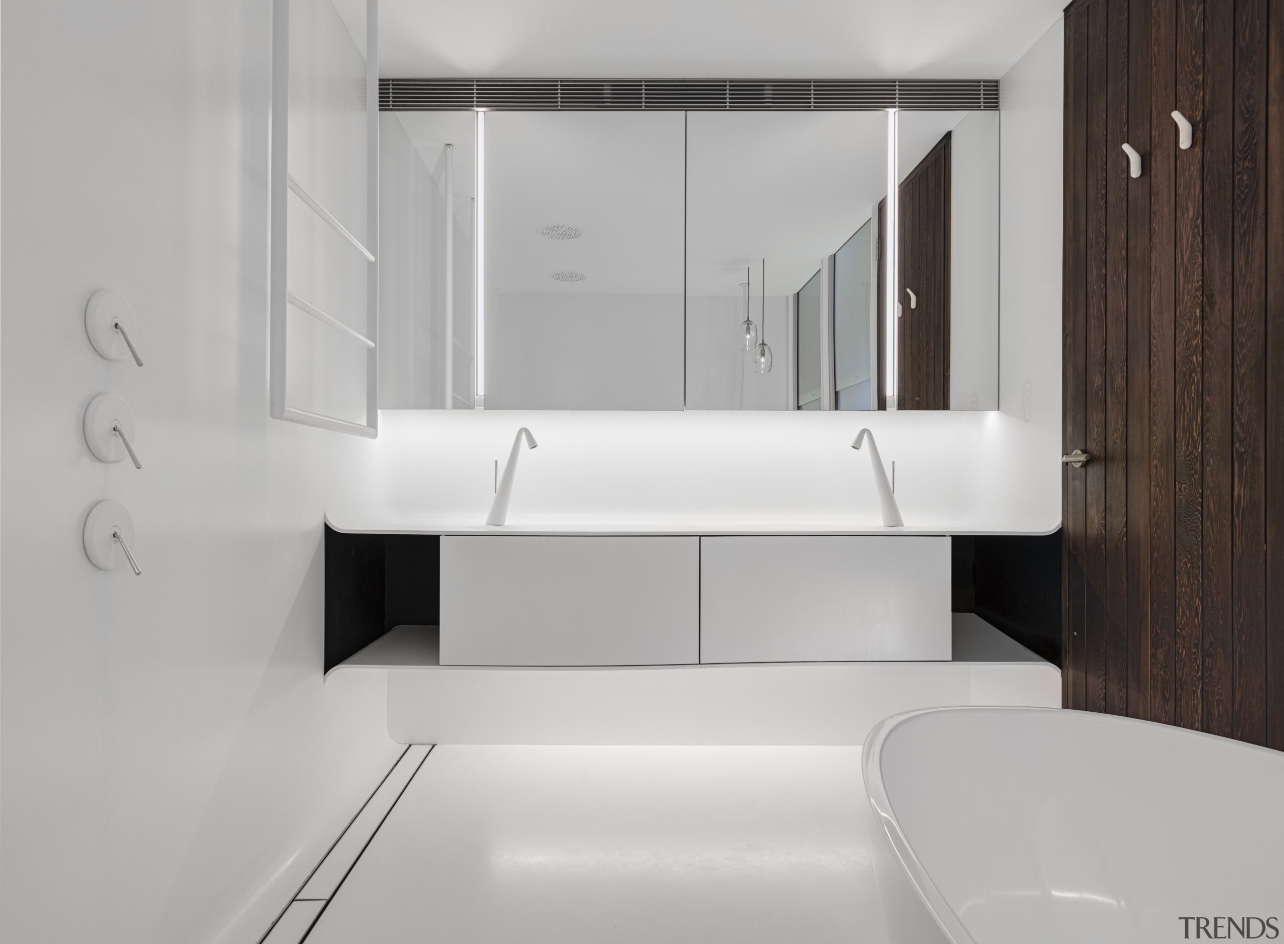 ​​​​​​​This main bathroom features a continuous Corian vanity gray