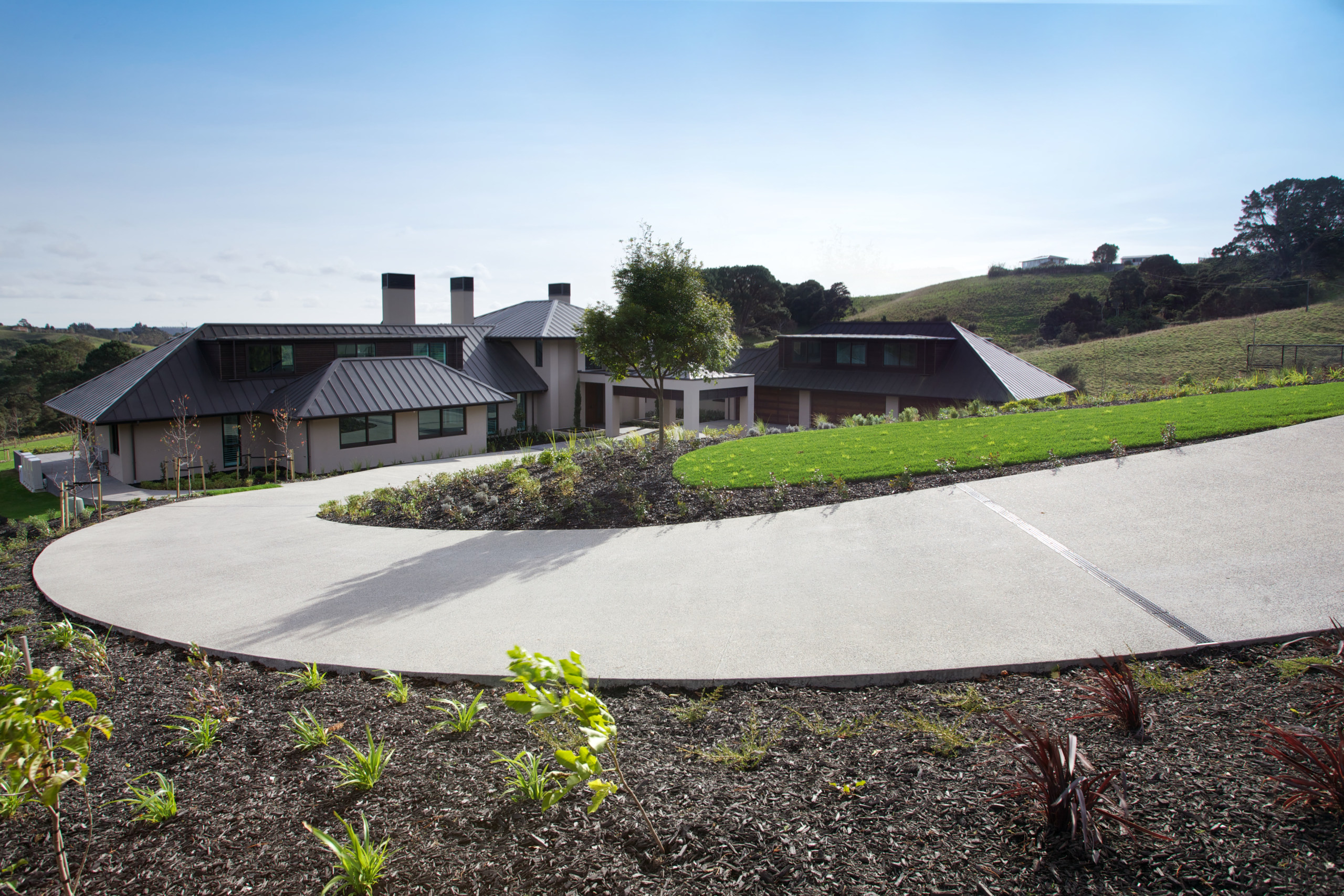 Concrete driveway of modern country home - Concrete architecture, area, asphalt, estate, grass, home, house, land lot, landscape, property, real estate, residential area, sky, white