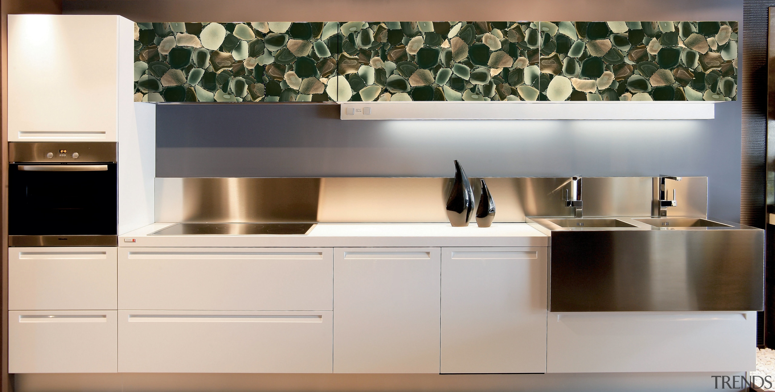 View of a contemporary kitchen which features countertops cabinetry, countertop, cuisine classique, furniture, home appliance, interior design, kitchen, kitchen stove, product design, white