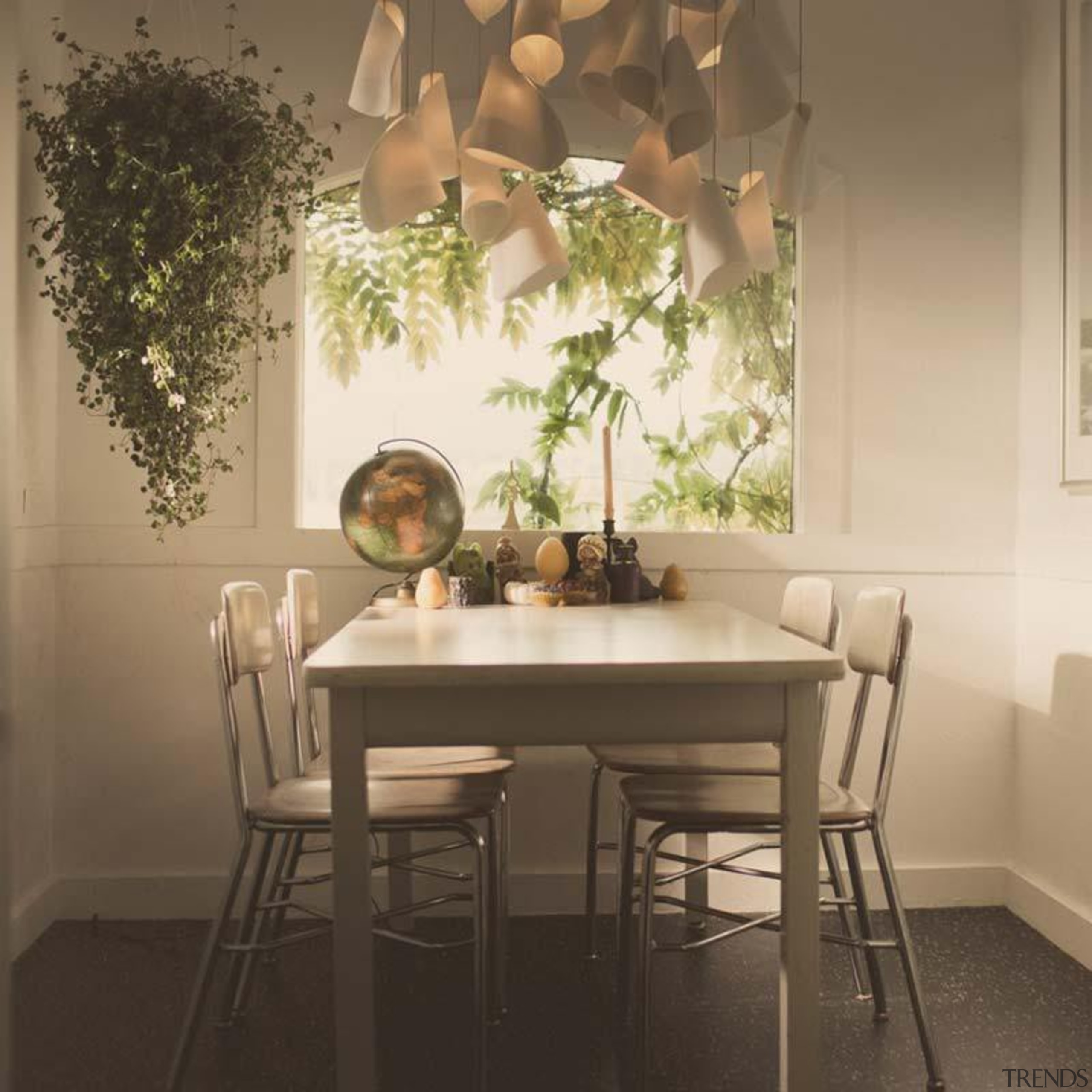 This is a low voltage chandelier; each individual chair, dining room, furniture, home, interior design, light fixture, room, table, window, brown, orange