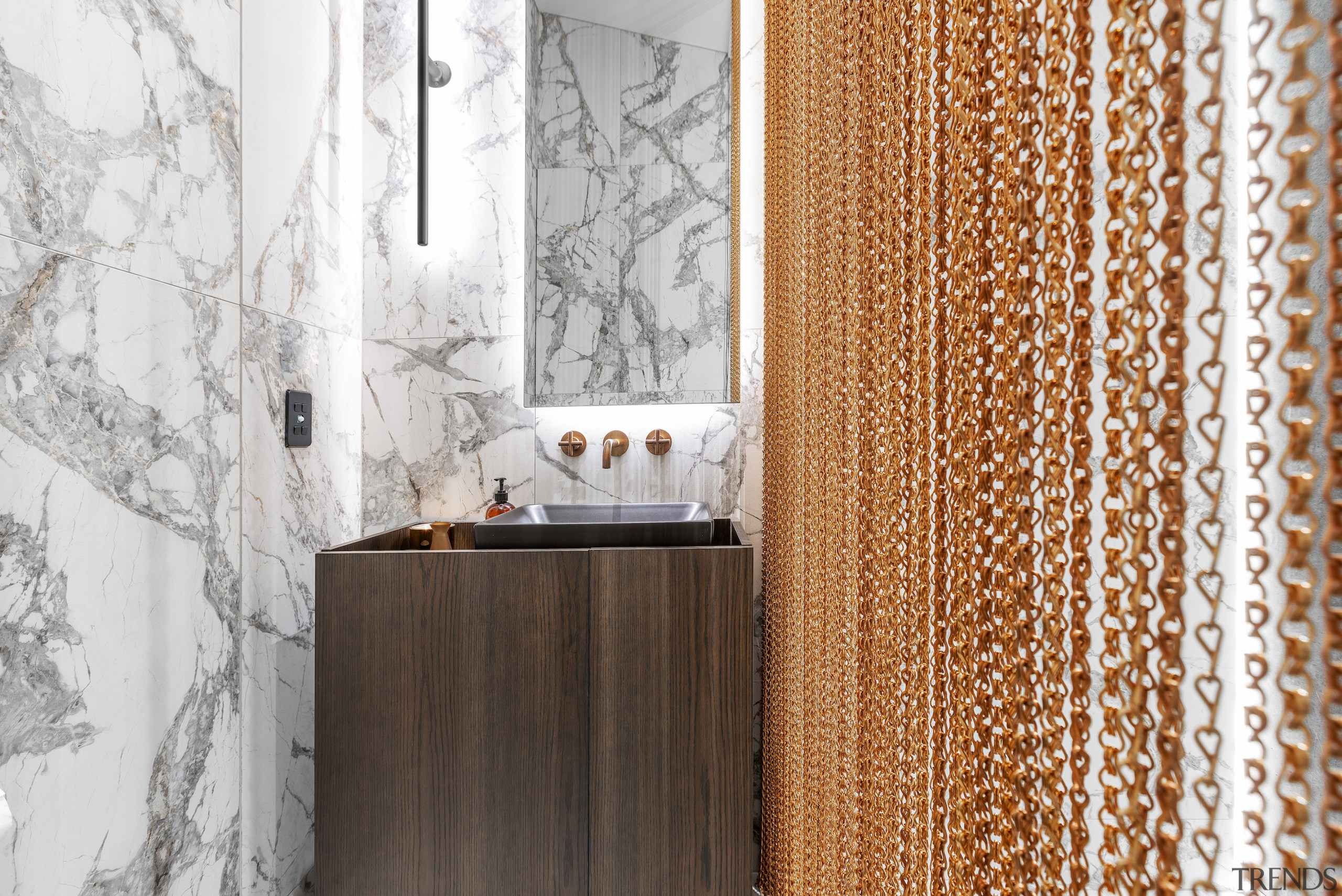 A bespoke, custom wall light and mirror with 