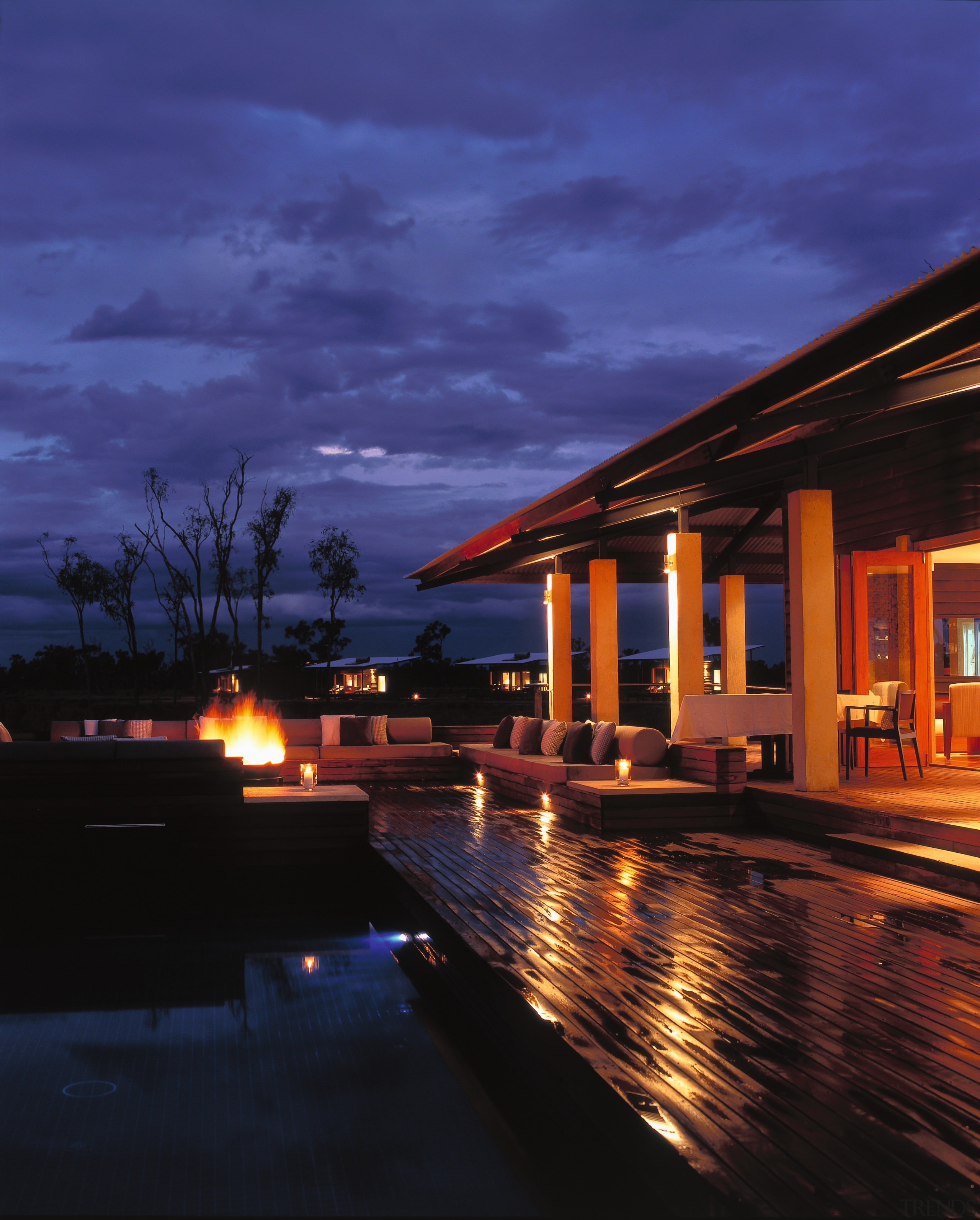 view of the outdoor area  wher rugged architecture, cloud, dusk, estate, evening, home, horizon, house, landscape lighting, lighting, night, real estate, reflection, residential area, resort, sky, sunset, water, blue, black