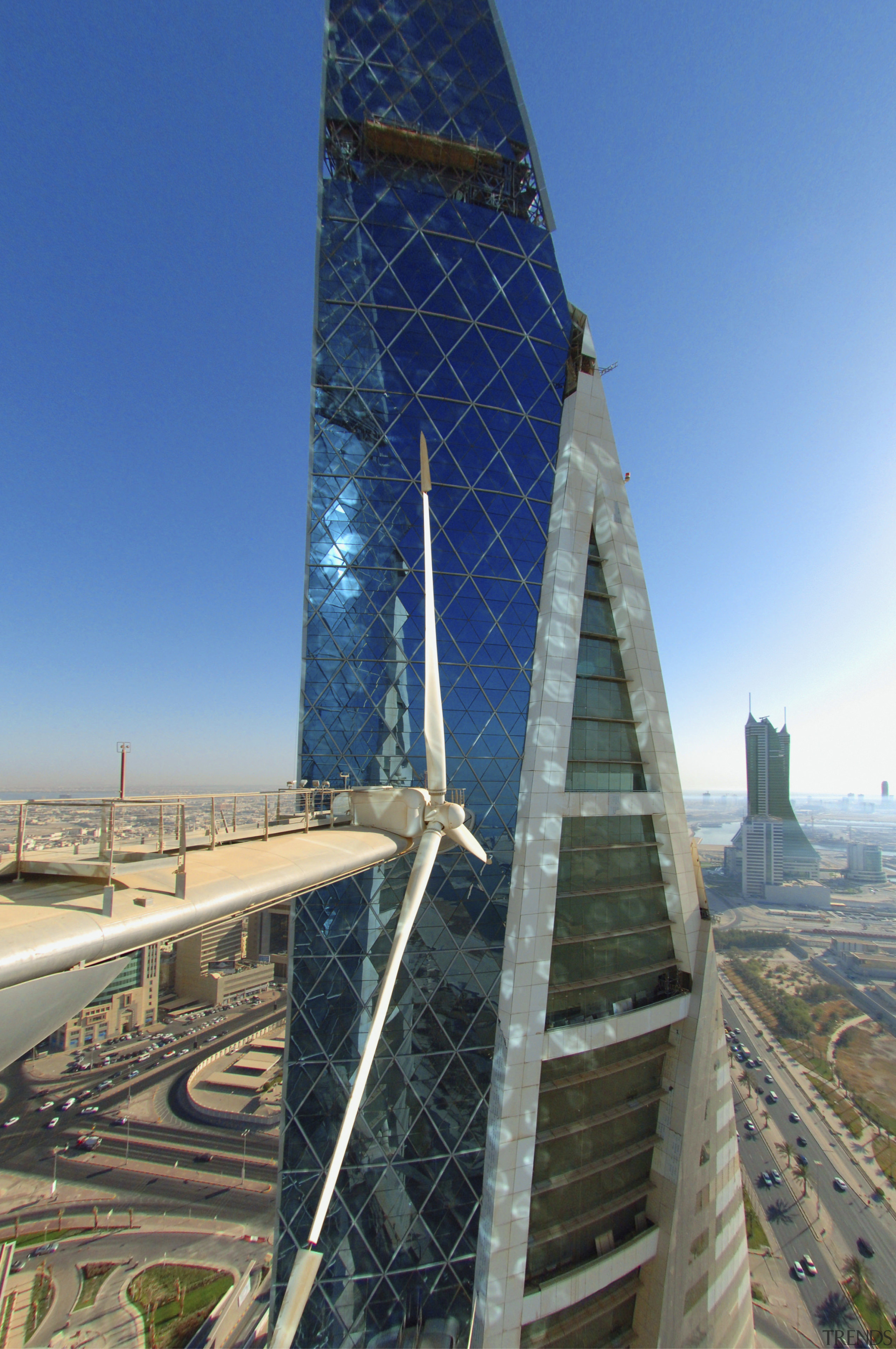 The new Bahrain world Trade Centre meets up building, daytime, landmark, metropolitan area, sky, skyscraper, tower, blue