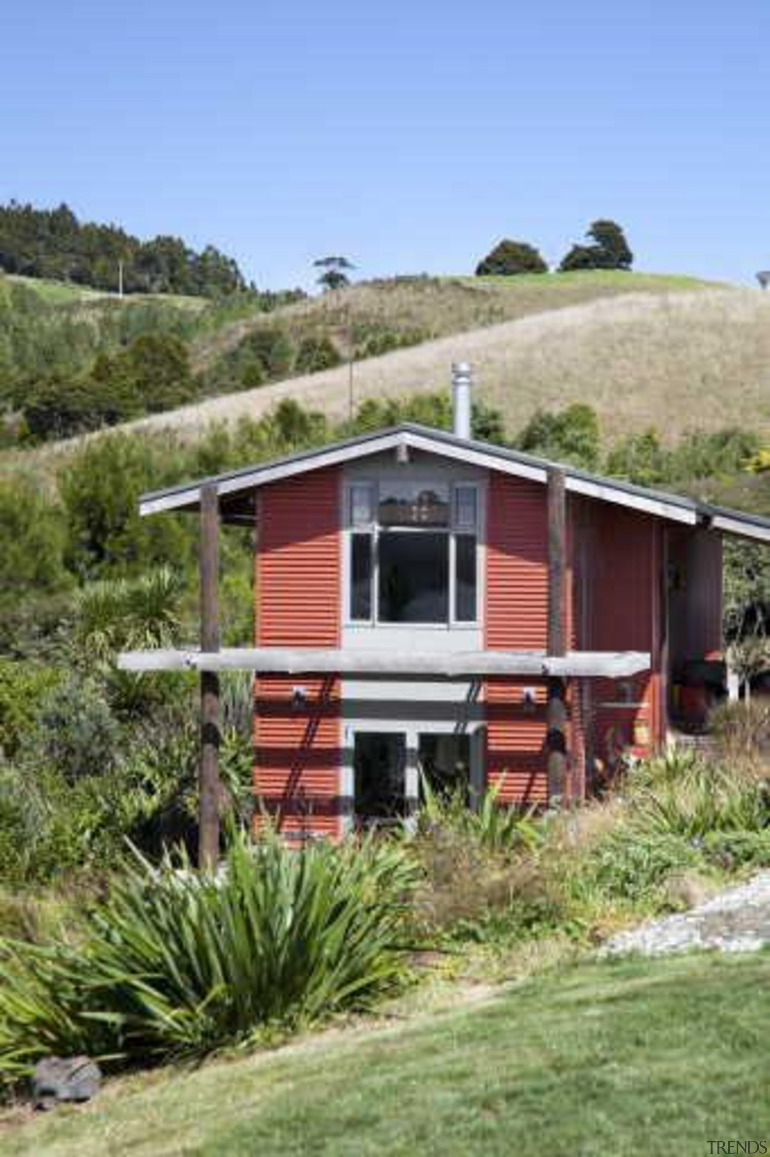 Exterior view of red house surrounded by trees cottage, home, house, hut, landscape, railroad car, real estate, rolling stock, shack, shed