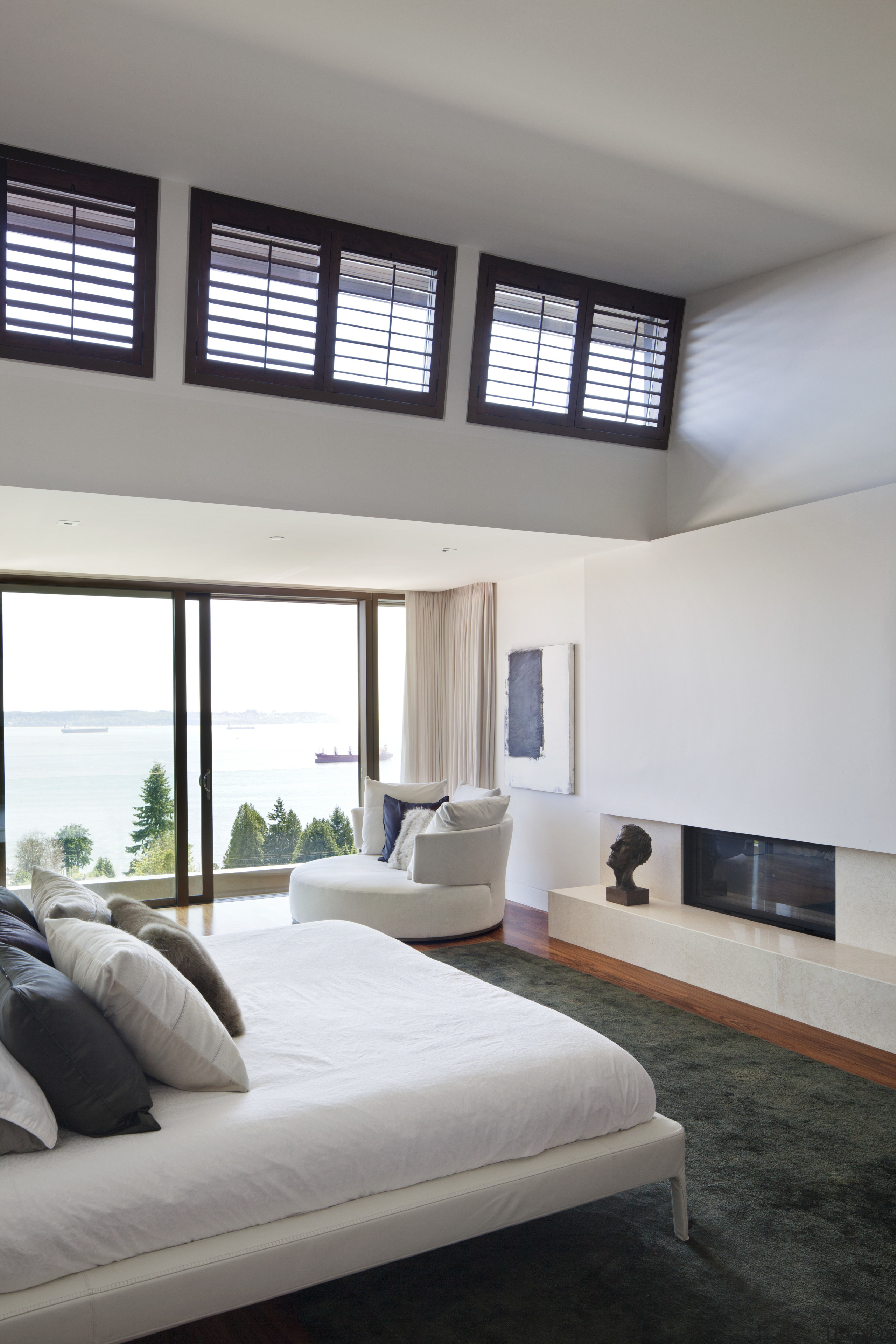 This is a home that was designed by architecture, bed frame, bedroom, ceiling, daylighting, floor, home, house, interior design, living room, real estate, room, window, window covering, white, gray