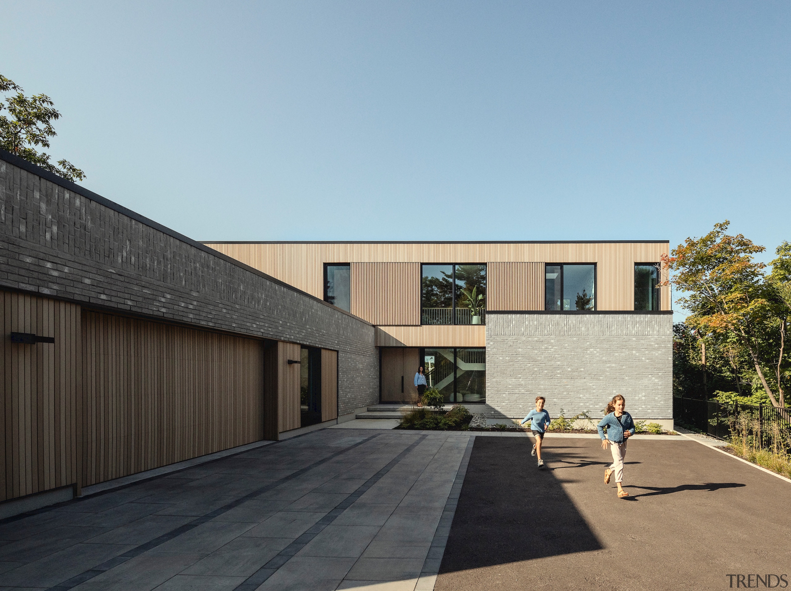 Front facade with garage at left. - Material 