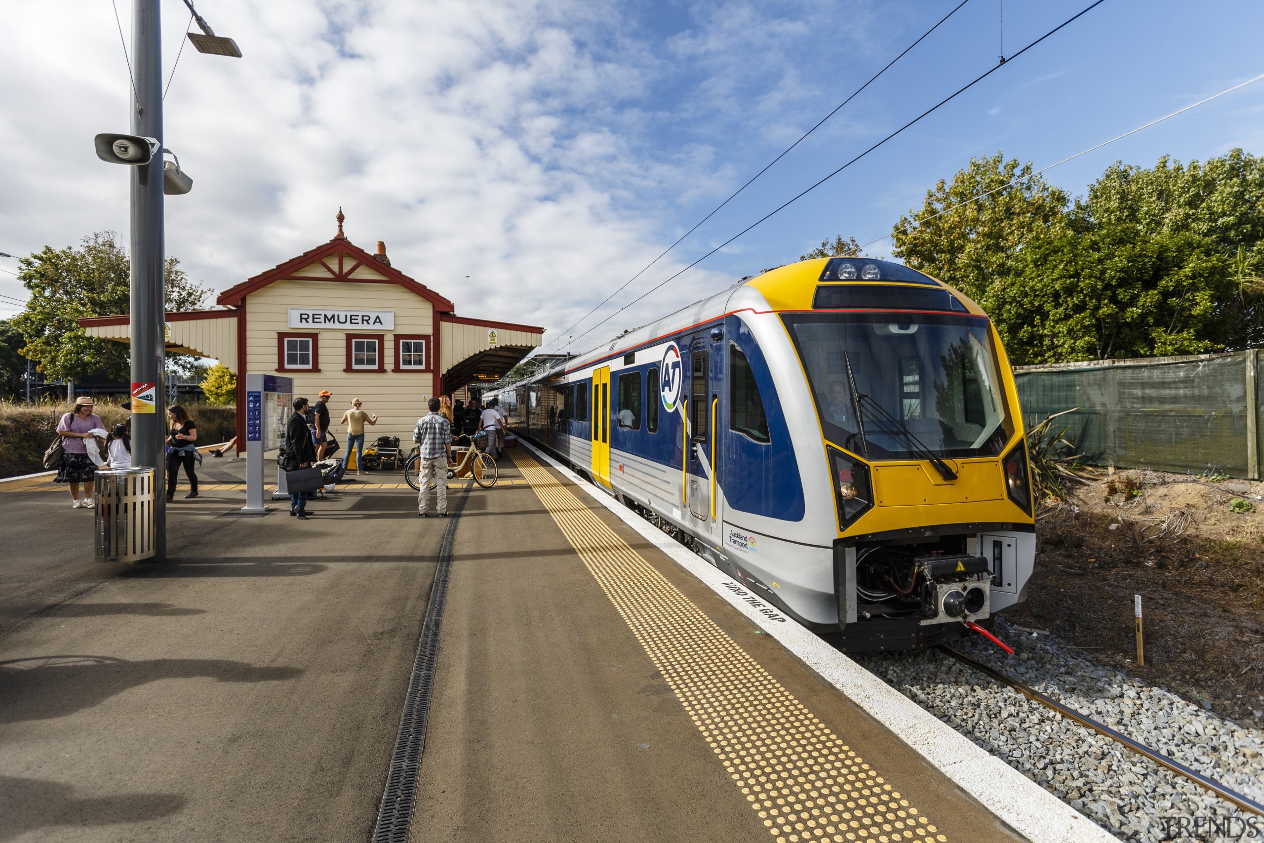 Historic Remuera station has been given a facelift. metropolitan area, mode of transport, public transport, rail transport, railroad car, track, train, train station, transport, vehicle, brown