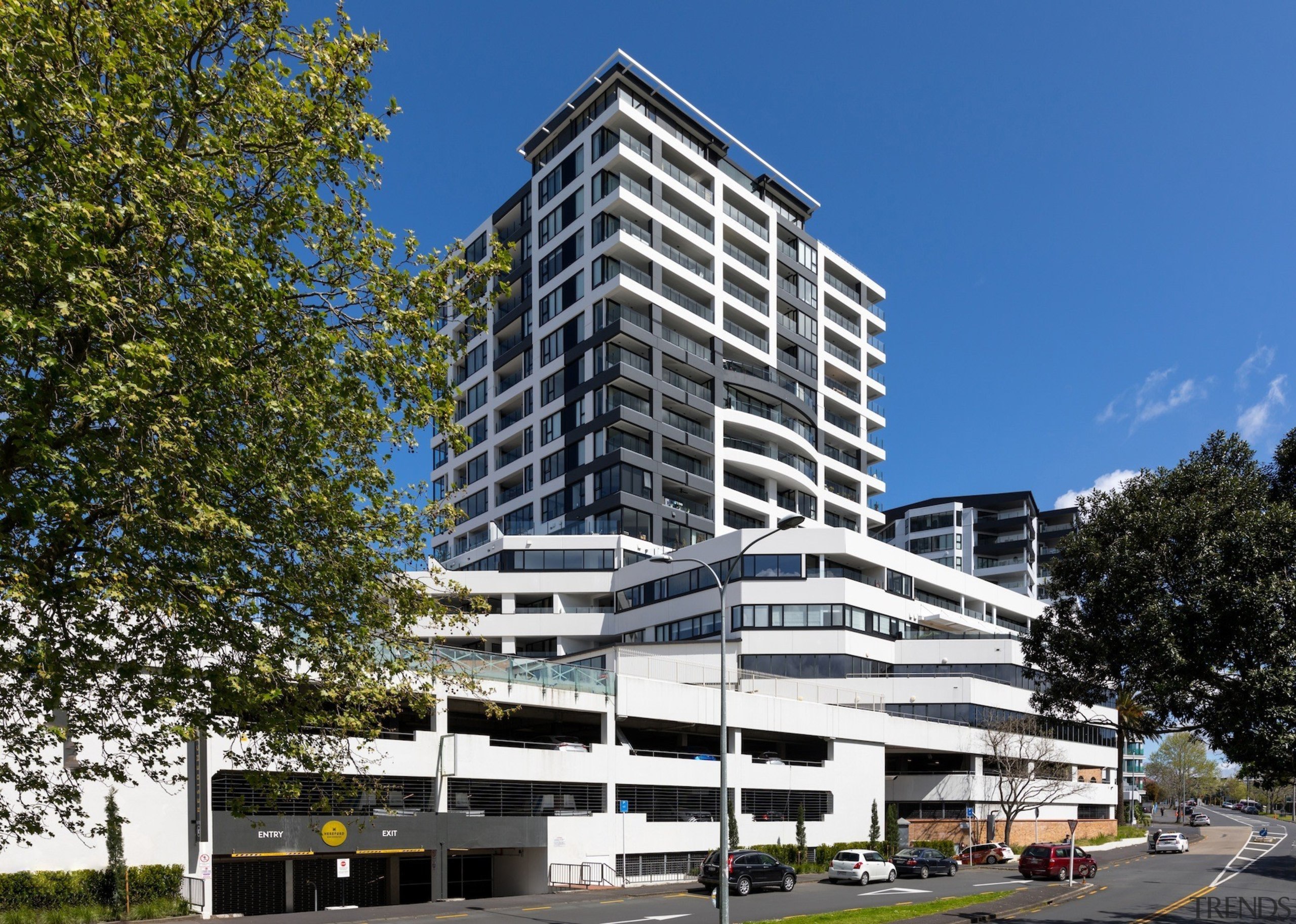 The TIDA NZ Architect-designed apartment winner – Paul apartment, architecture, building, city, commercial building, condominium, corporate headquarters, daytime, facade, headquarters, hotel, house, metropolis, metropolitan area, mixed use, neighbourhood, property, real estate, residential area, tower block, blue