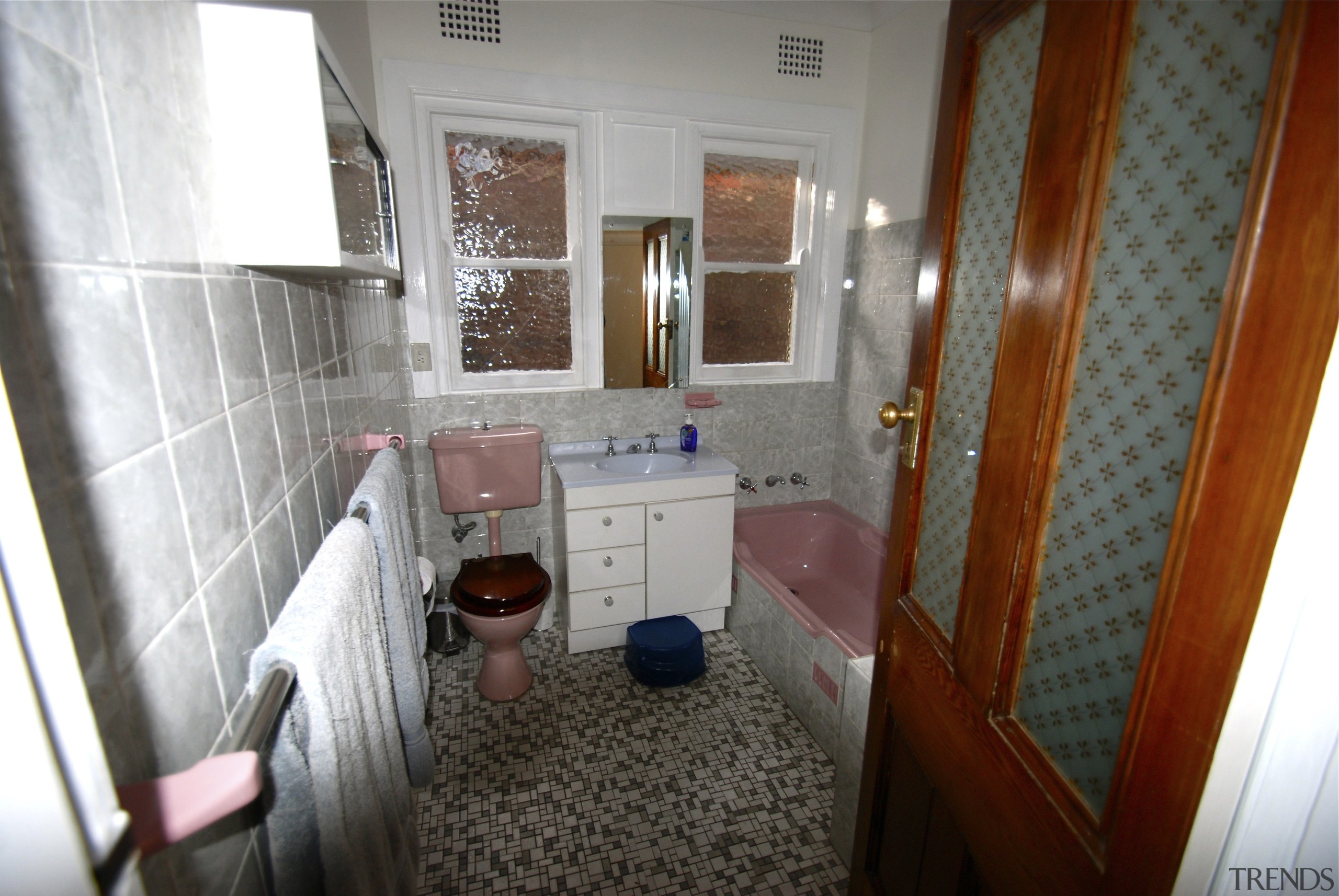 Situational bathroom setting, pink, white, tiles, small bathroom, floor, home, house, property, real estate, room, gray, white