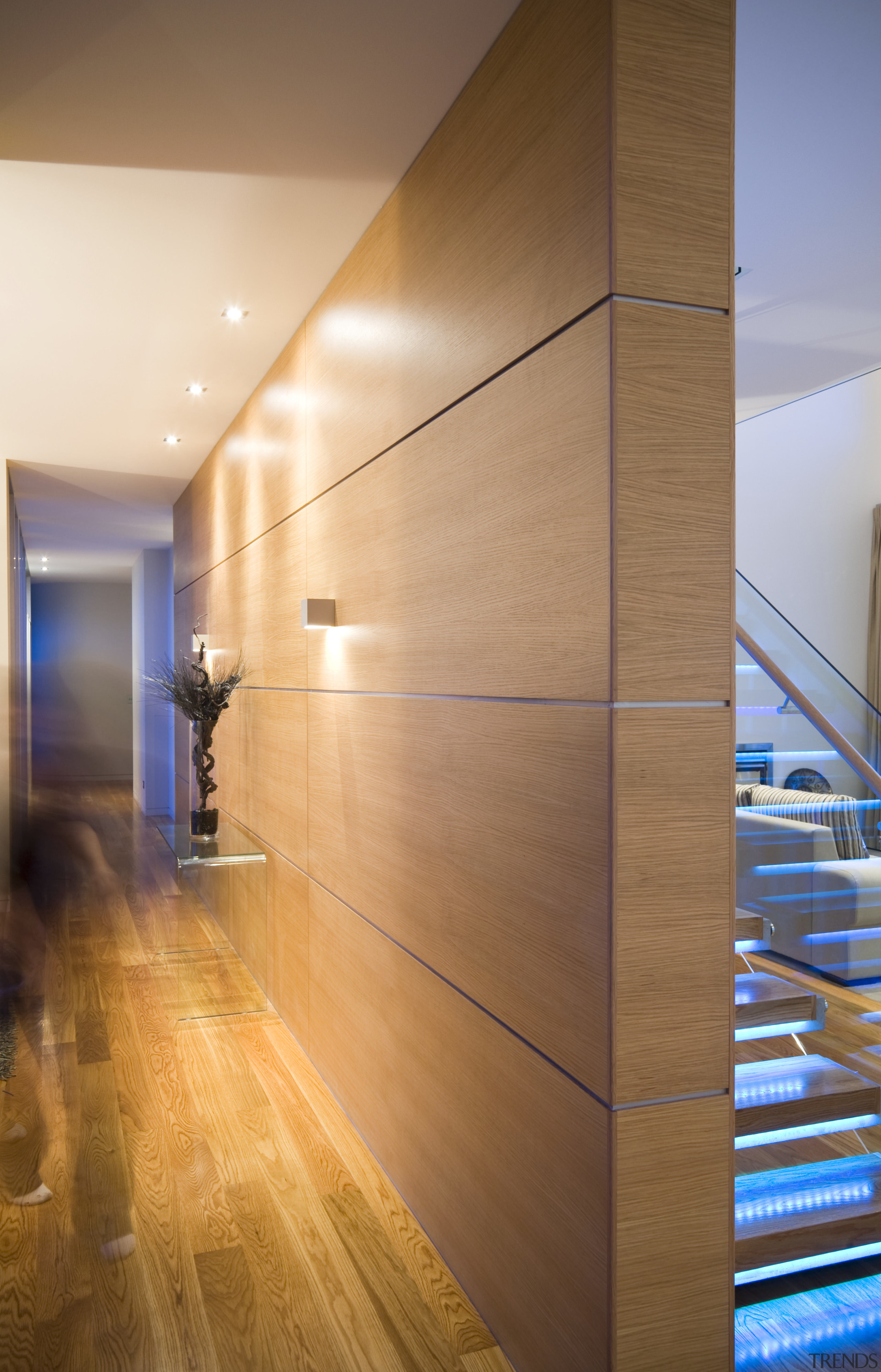 An oak veneer feature wall creates a warm apartment, architecture, ceiling, daylighting, floor, flooring, glass, handrail, hardwood, interior design, laminate flooring, lighting, lobby, loft, real estate, stairs, wall, wood, wood flooring, wood stain, brown, orange