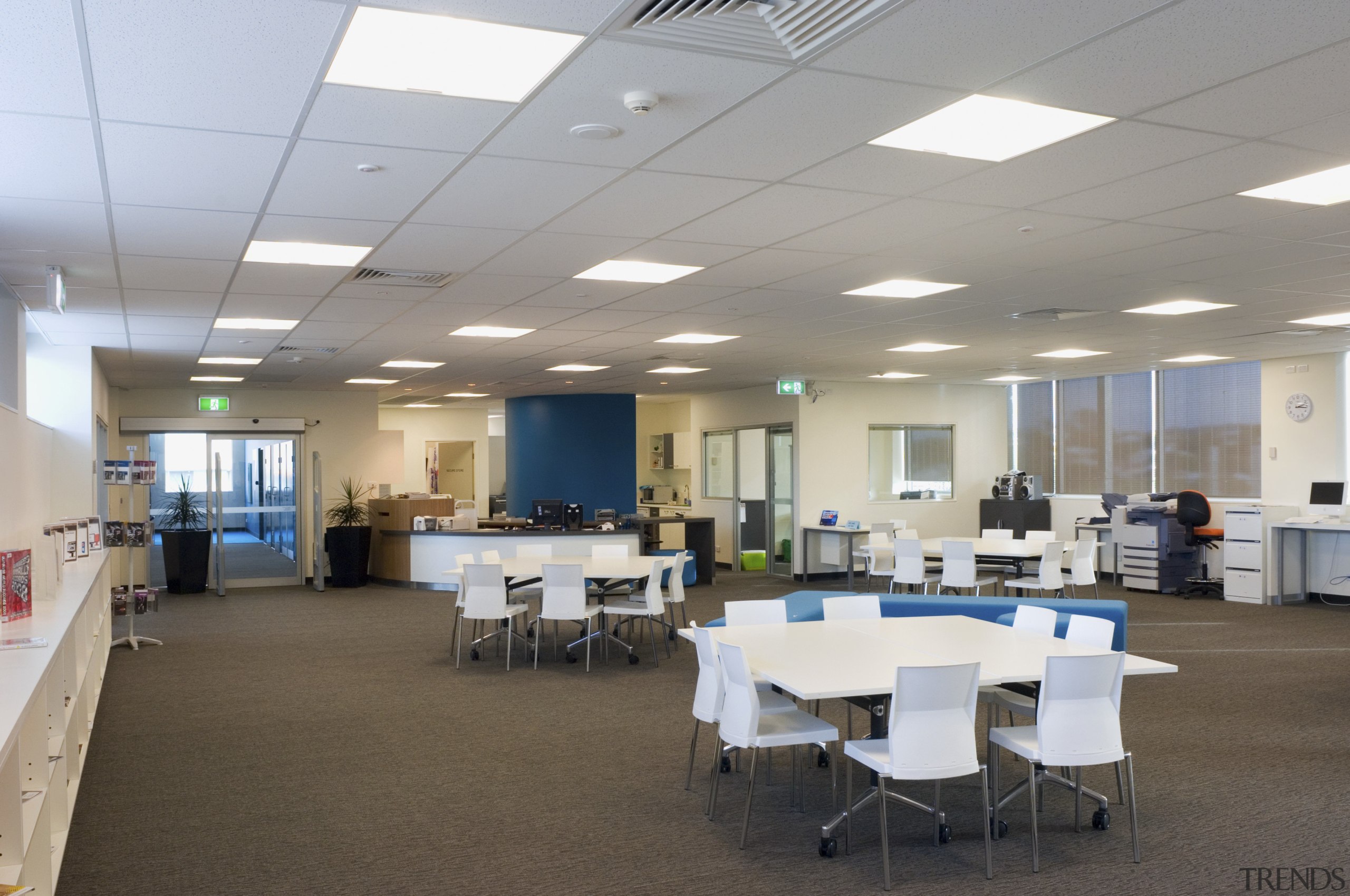 View of one of several study areas at ceiling, classroom, conference hall, daylighting, institution, interior design, office, table, gray