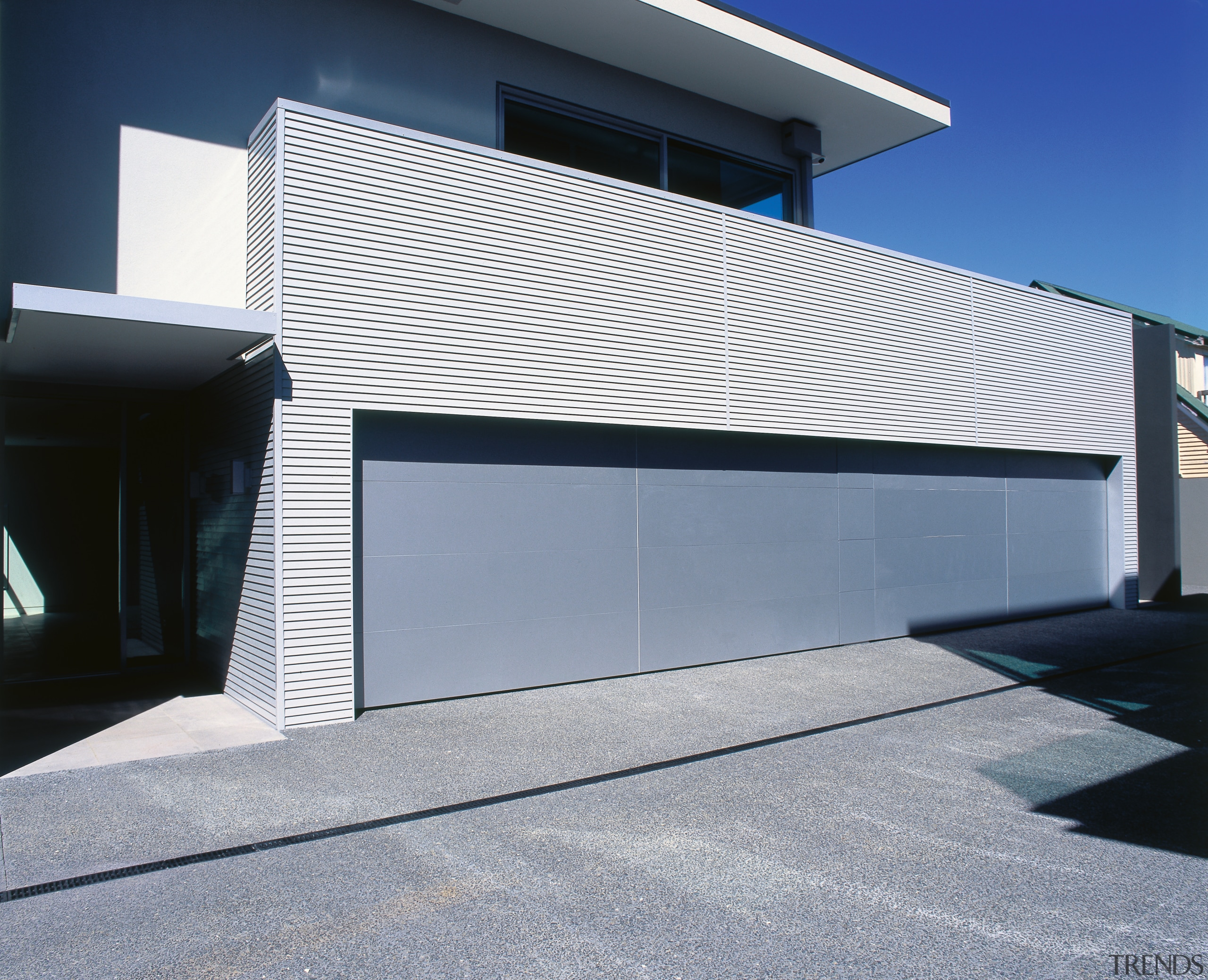 A view of some cladding from Maxwells. - architecture, building, commercial building, daylighting, door, facade, garage, garage door, house, siding, window, gray