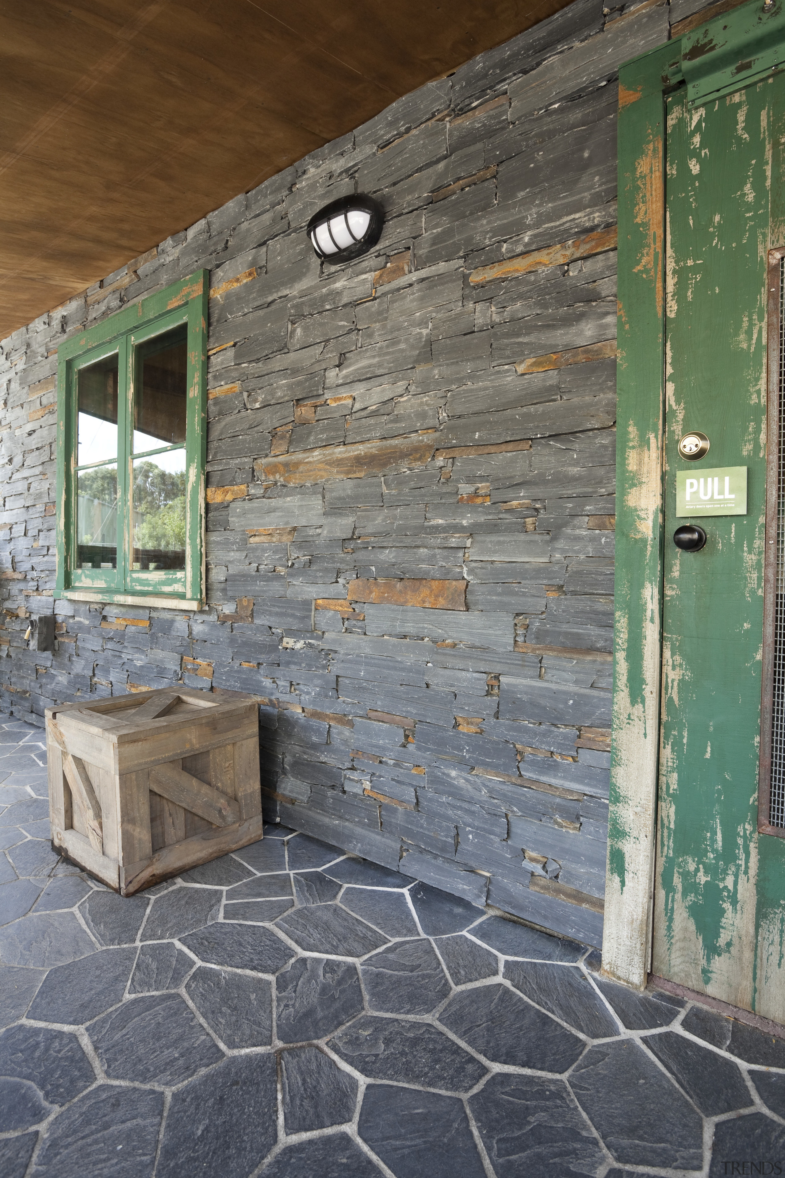 View of stone cladding. - View of stone architecture, brick, brickwork, door, facade, floor, home, house, wall, window, wood, gray