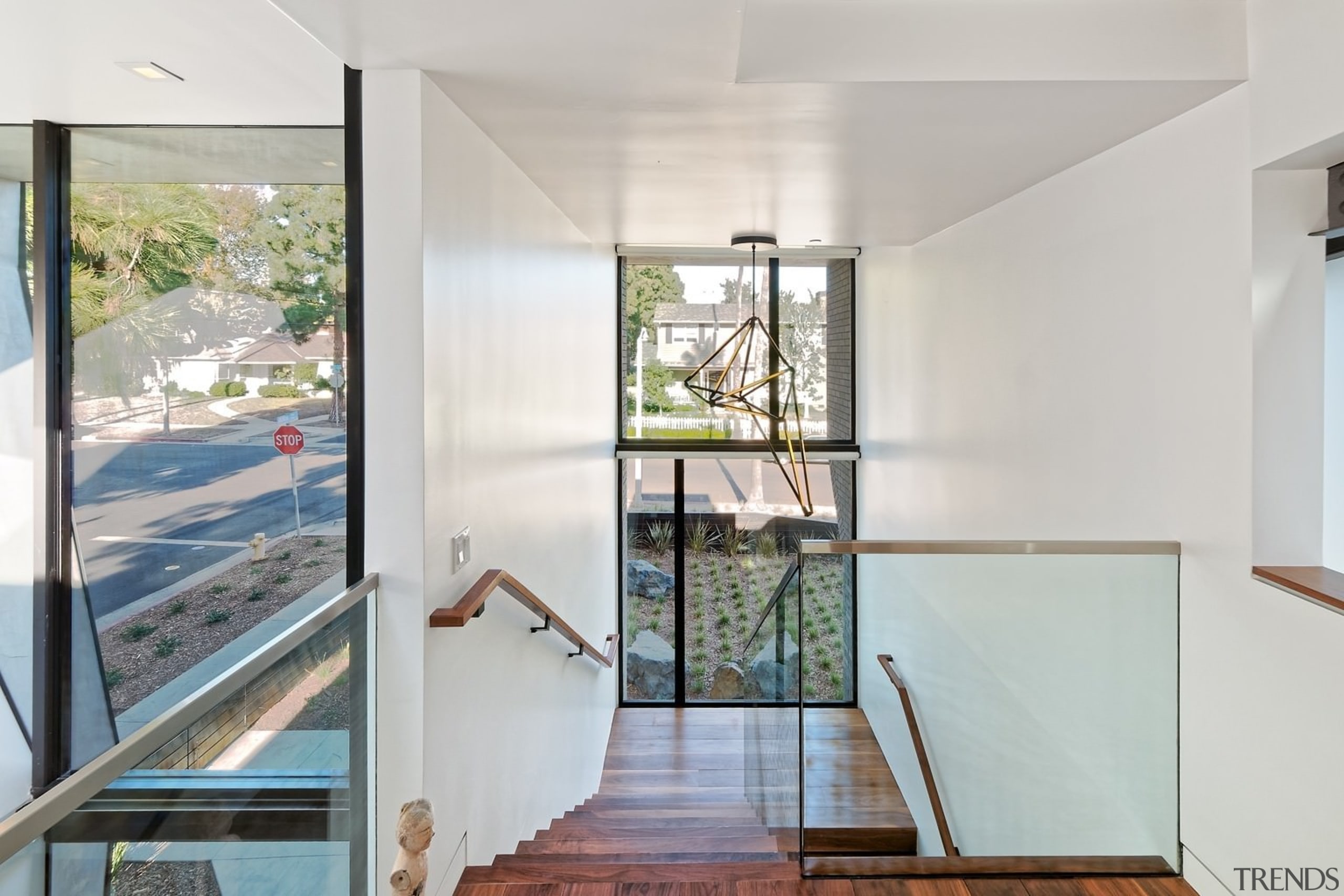 A glass balustrade ensures clean sight lines through architecture, daylighting, door, floor, handrail, home, house, interior design, property, real estate, window, gray