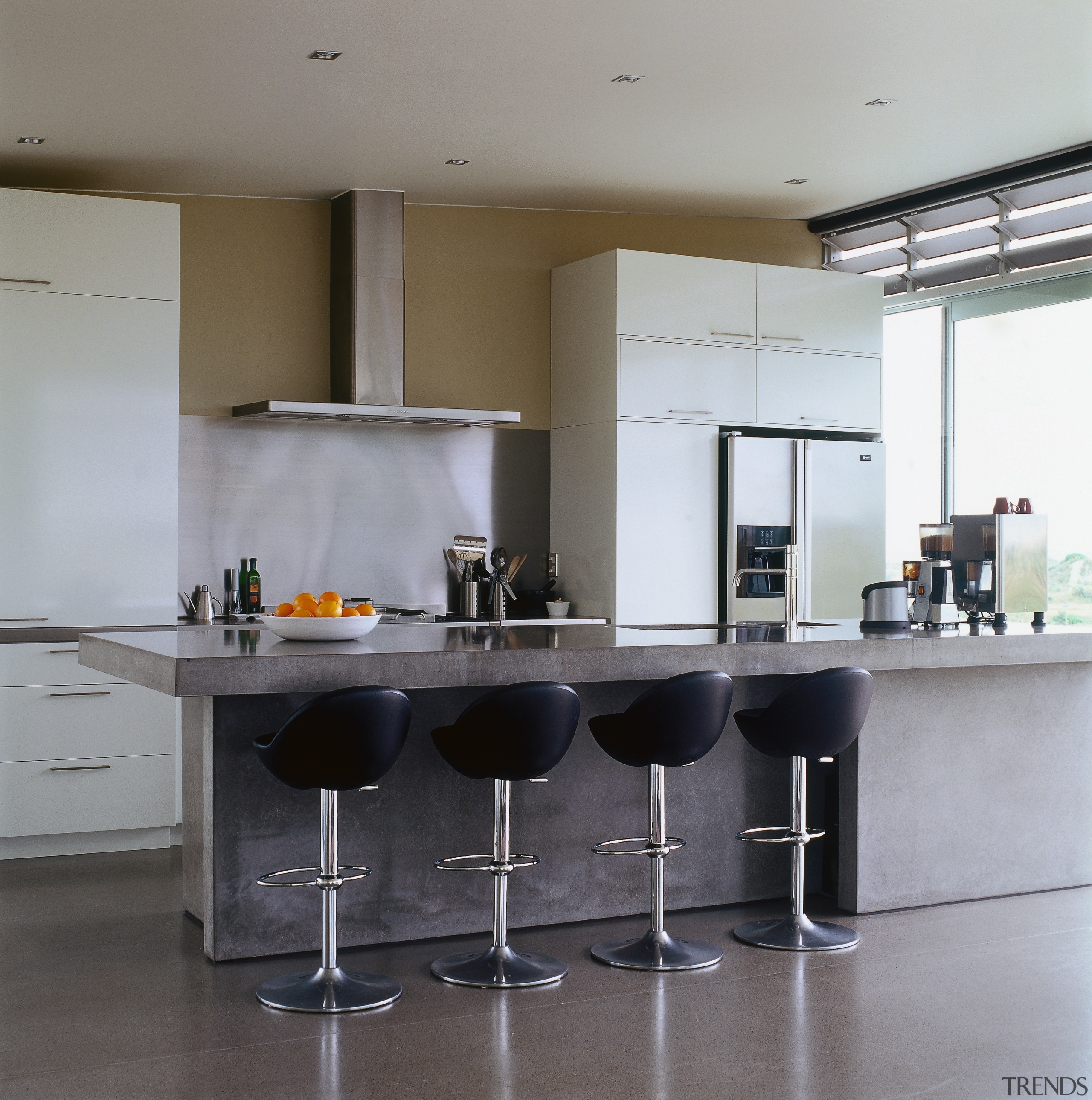 A view of the kitchen featuring two banks countertop, floor, interior design, kitchen, product design, table, gray