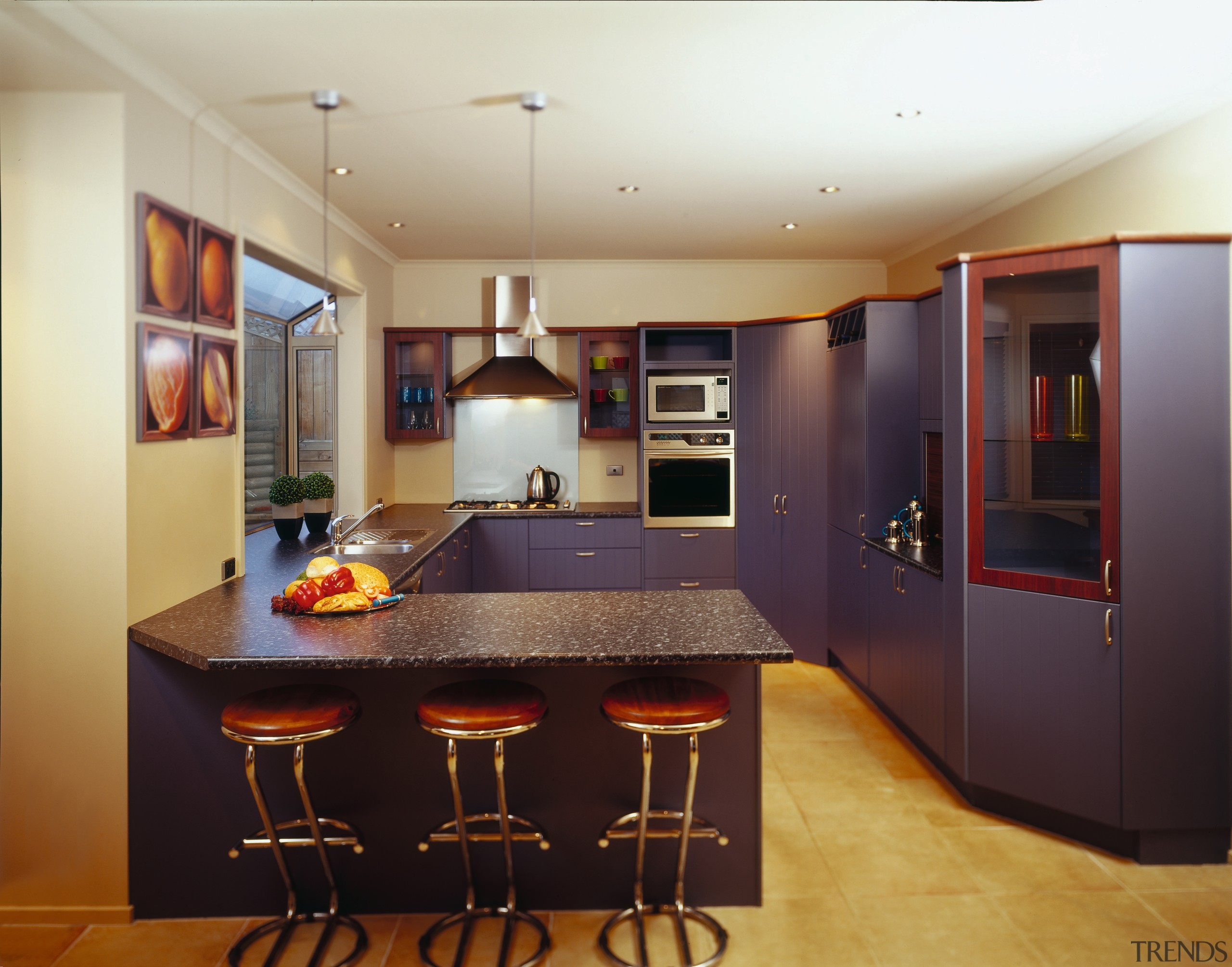 Kitchen with blue purple coloured doors in tongue cabinetry, countertop, interior design, kitchen, real estate, room, black, orange