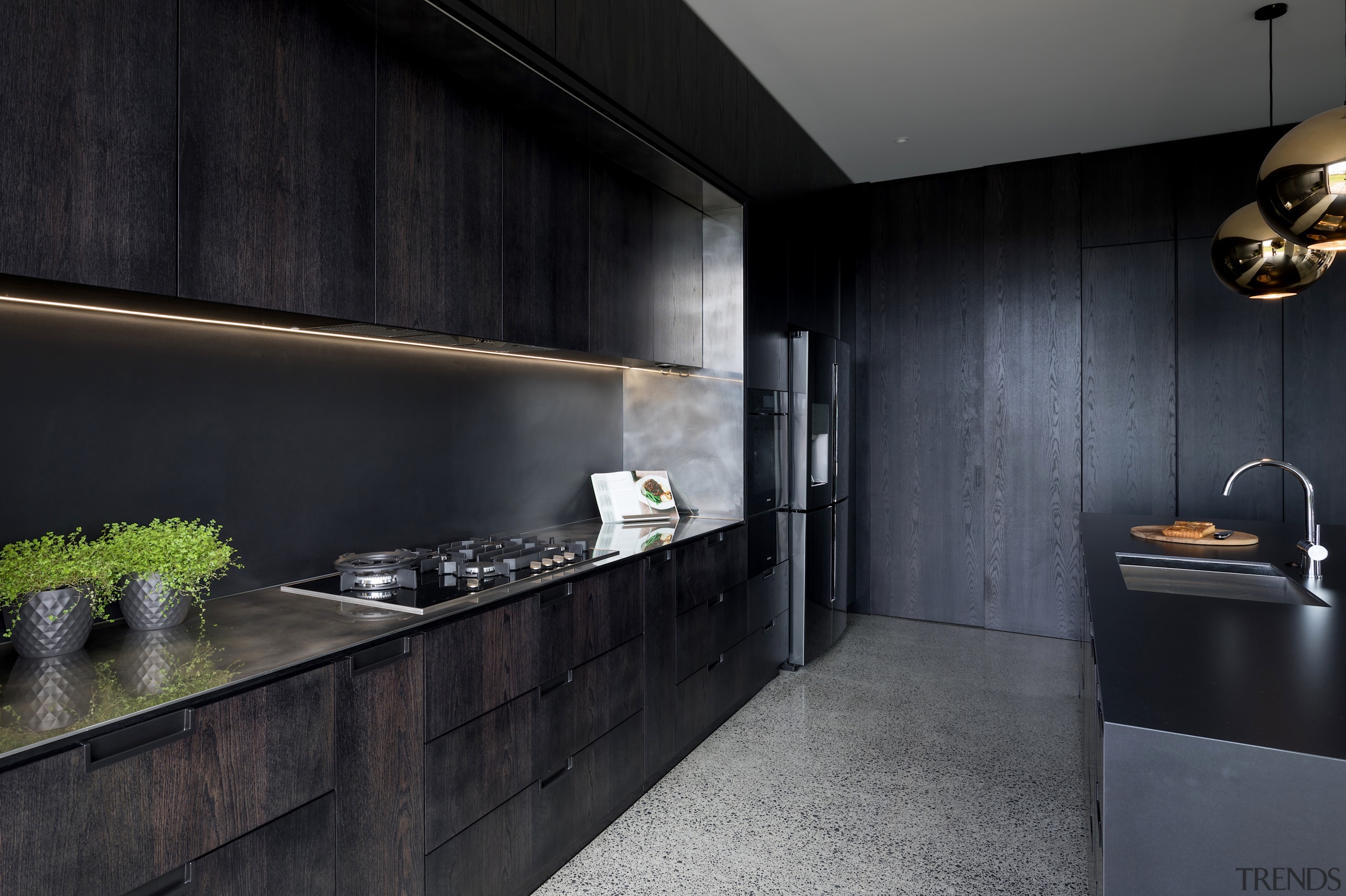 The dark stained oak cabinetry and Florim Matte architecture, building, cabinetry, ceiling, countertop, floor, flooring, furniture, house, interior design, kitchen, kitchen stove, material property, property, room, tile, under-cabinet lighting, black, gray