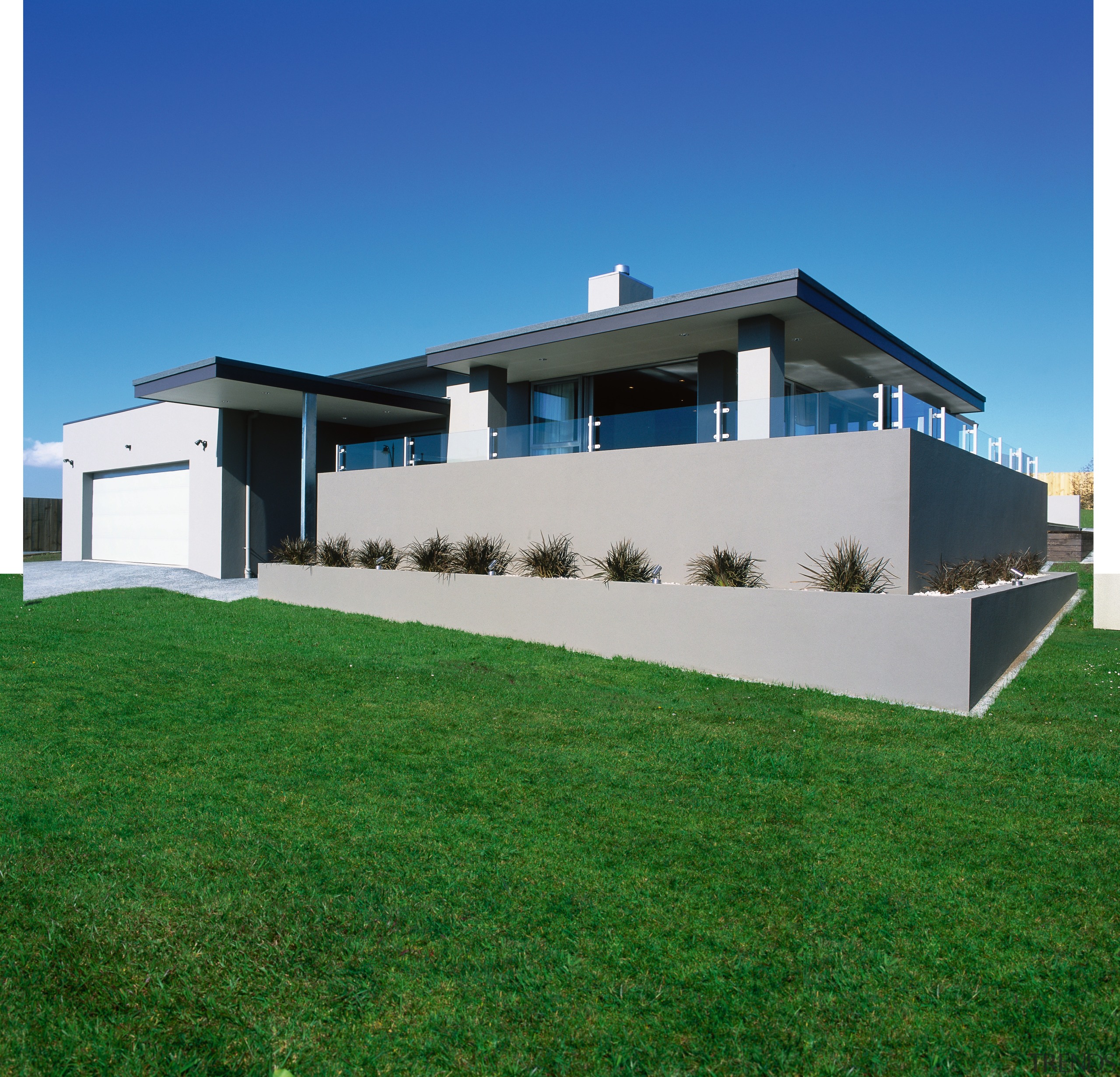 View of the front entrance garden - View architecture, elevation, estate, facade, grass, home, house, land lot, official residence, property, real estate, residential area, roof, sky, villa, green