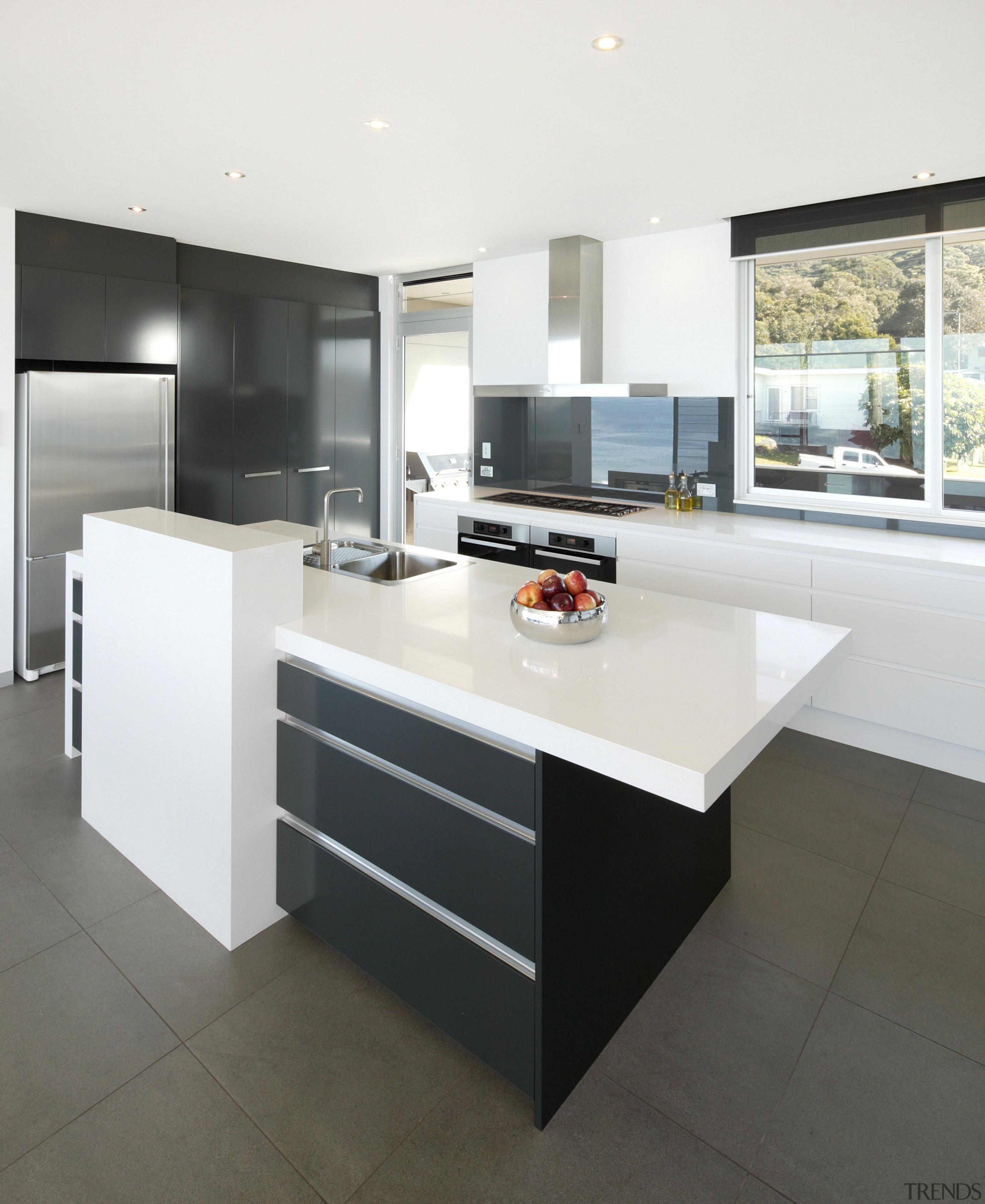 View of kitchen and dining area  designed cabinetry, countertop, cuisine classique, floor, furniture, interior design, kitchen, product design, table, white