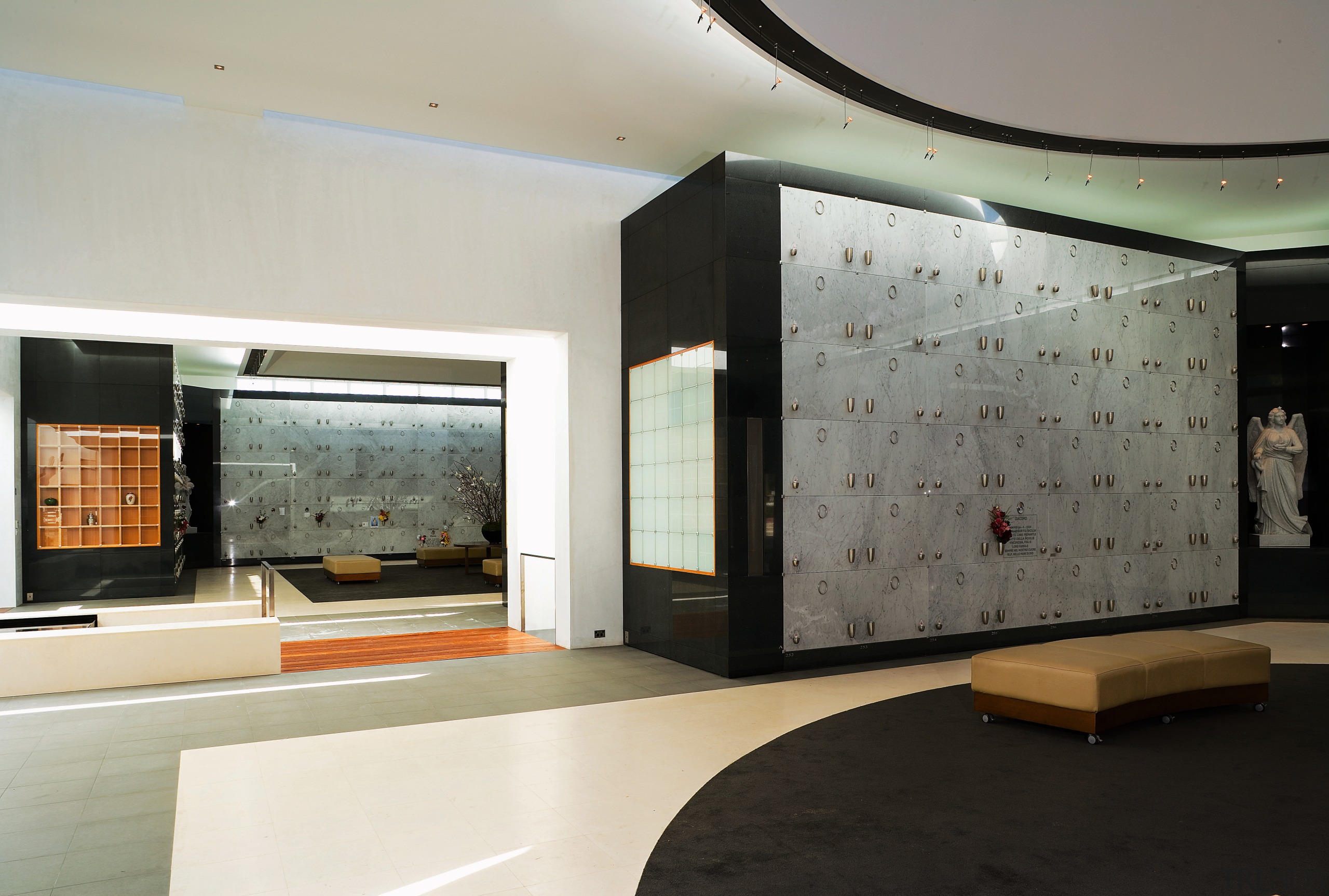 view of the marble crypts that line the ceiling, exhibition, interior design, lobby, gray