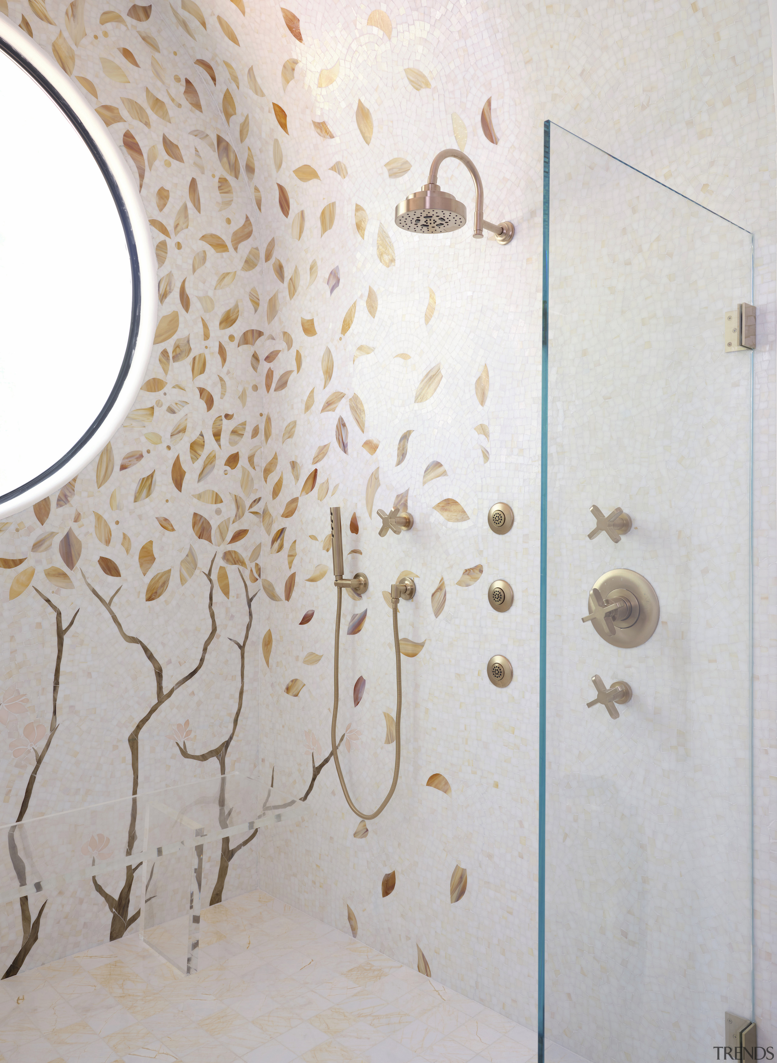 A glass screen and gilded fixtures remind you 