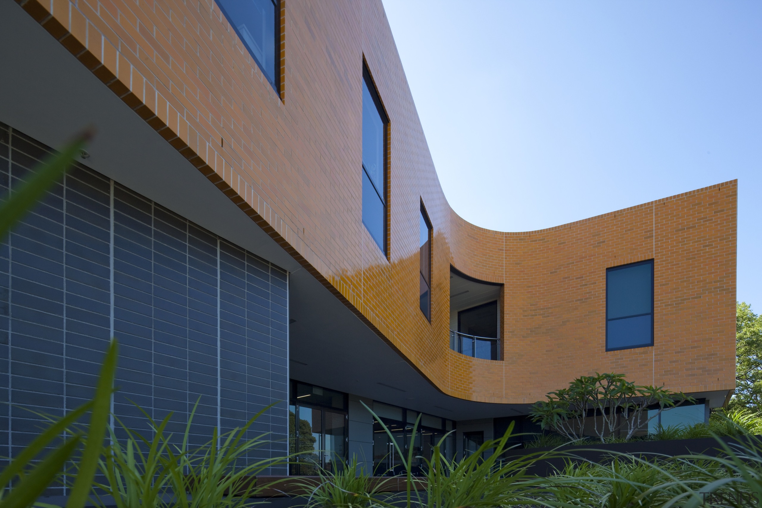 Exterior view of the Poche Centre which was architecture, building, corporate headquarters, elevation, facade, home, house, real estate, residential area, sky