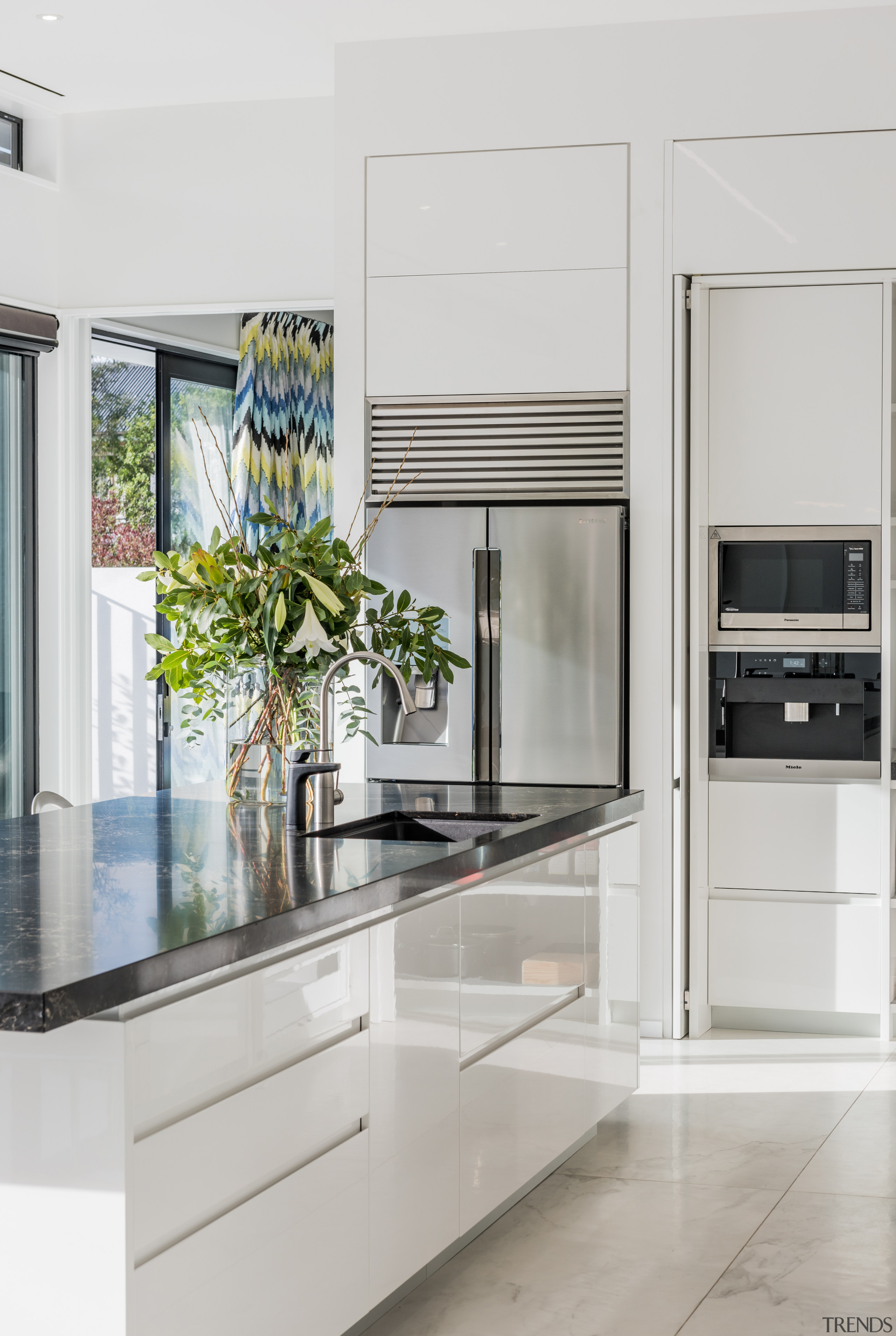 ​​​​​​​With a side door open, this kitchen is cabinetry, countertop, benchtop, Ceasarstone, classique, home appliance, kitchen, kitchen appliances, white Kitchen,  Emma Morris, Eternodesign