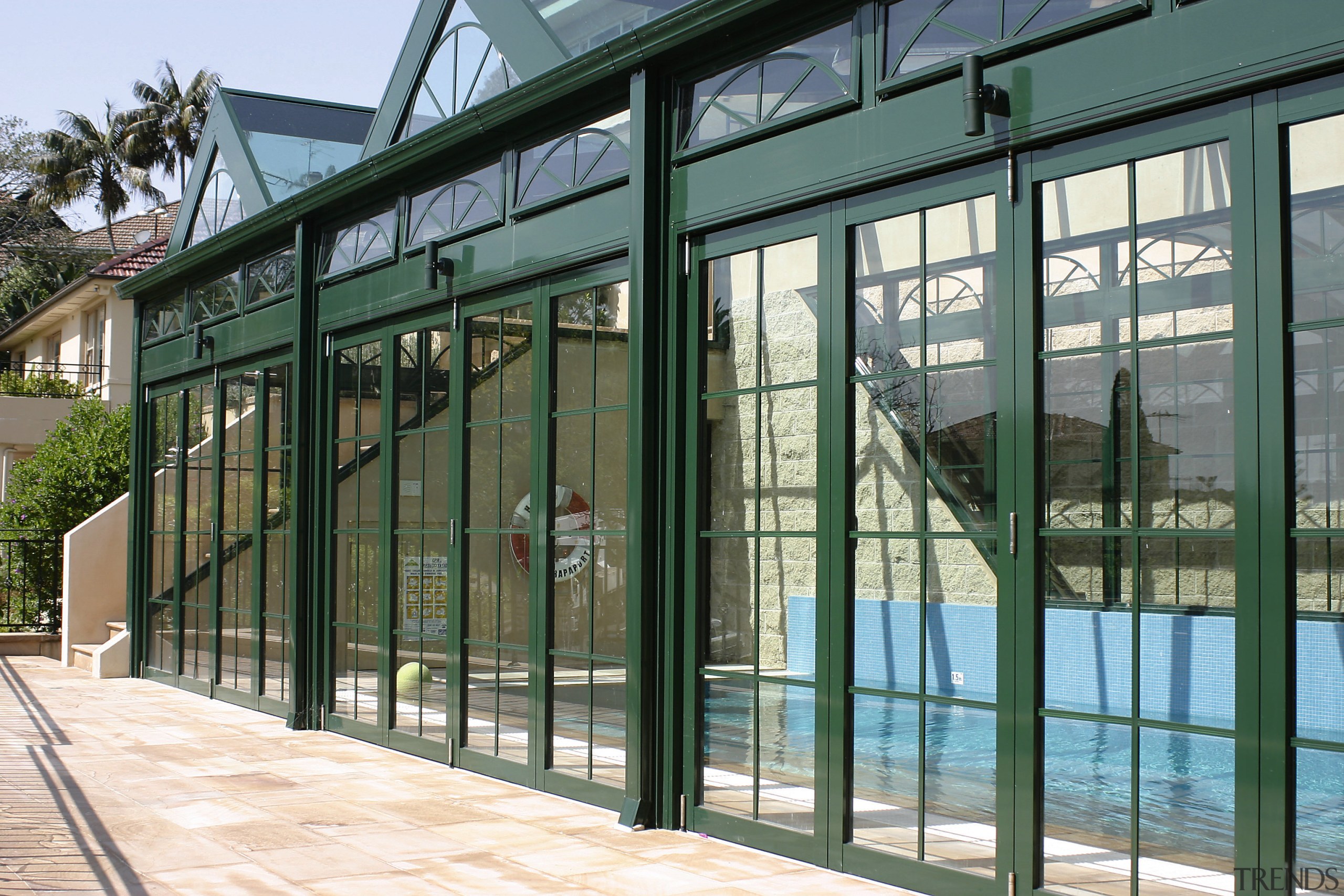 Side view of glass structure with pool inside, architecture, door, facade, fence, glass, iron, structure, window, gray