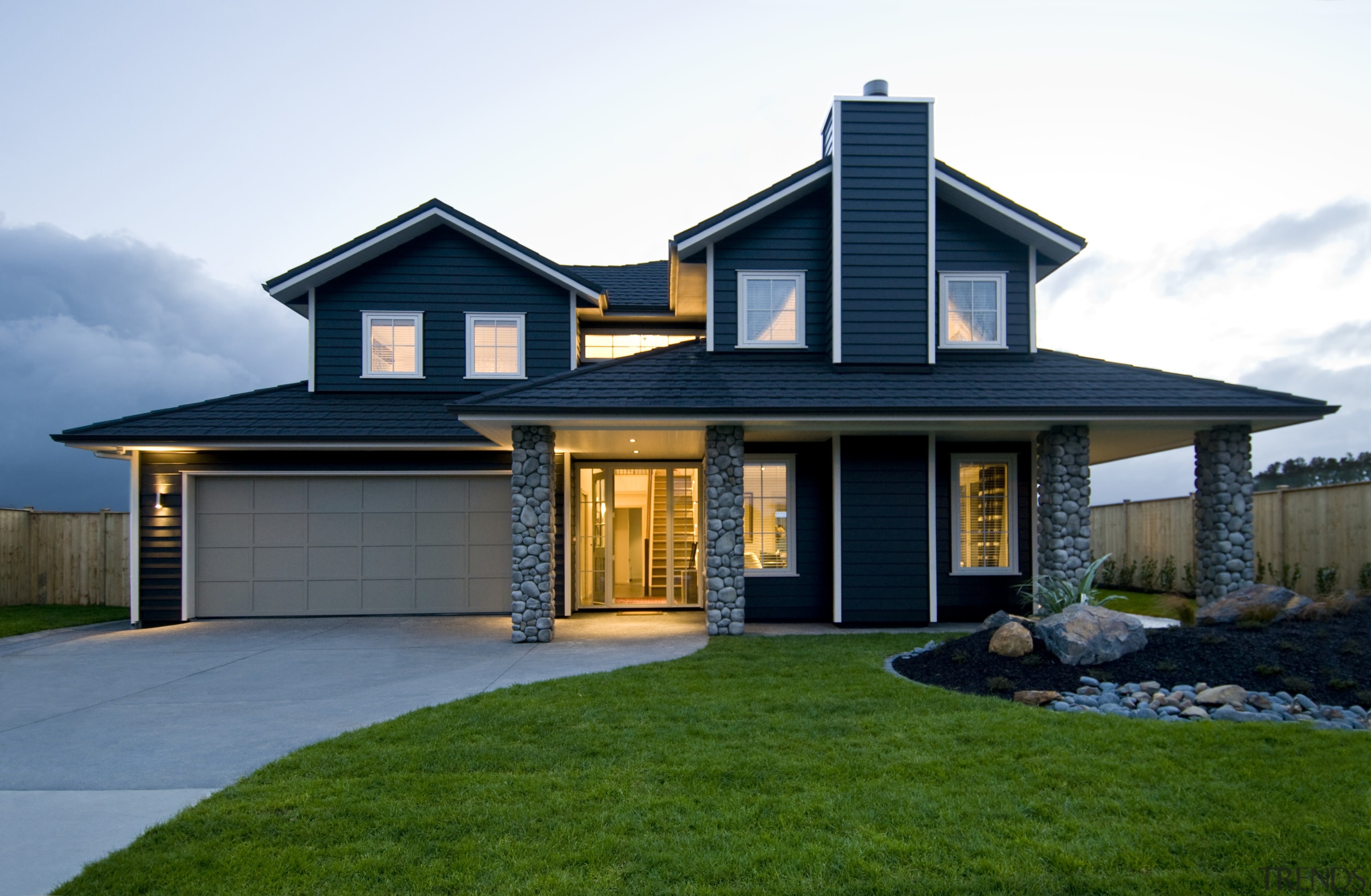 This Jalcon Home show home, Black Beauty, is building, cottage, elevation, estate, facade, home, house, property, real estate, residential area, roof, siding, window, white