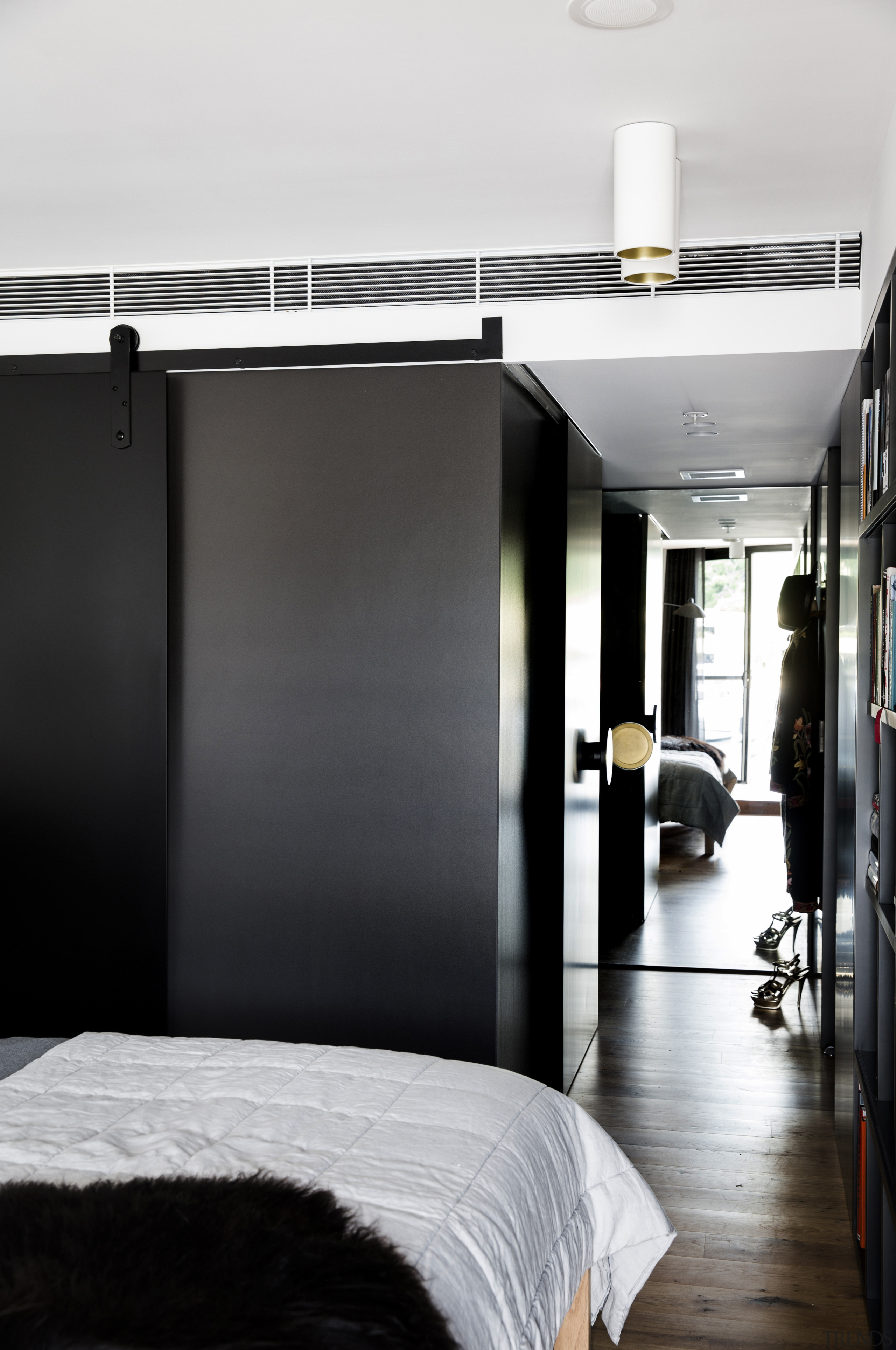 A black sliding wall panel can close down floor, furniture, interior design, room, black, white