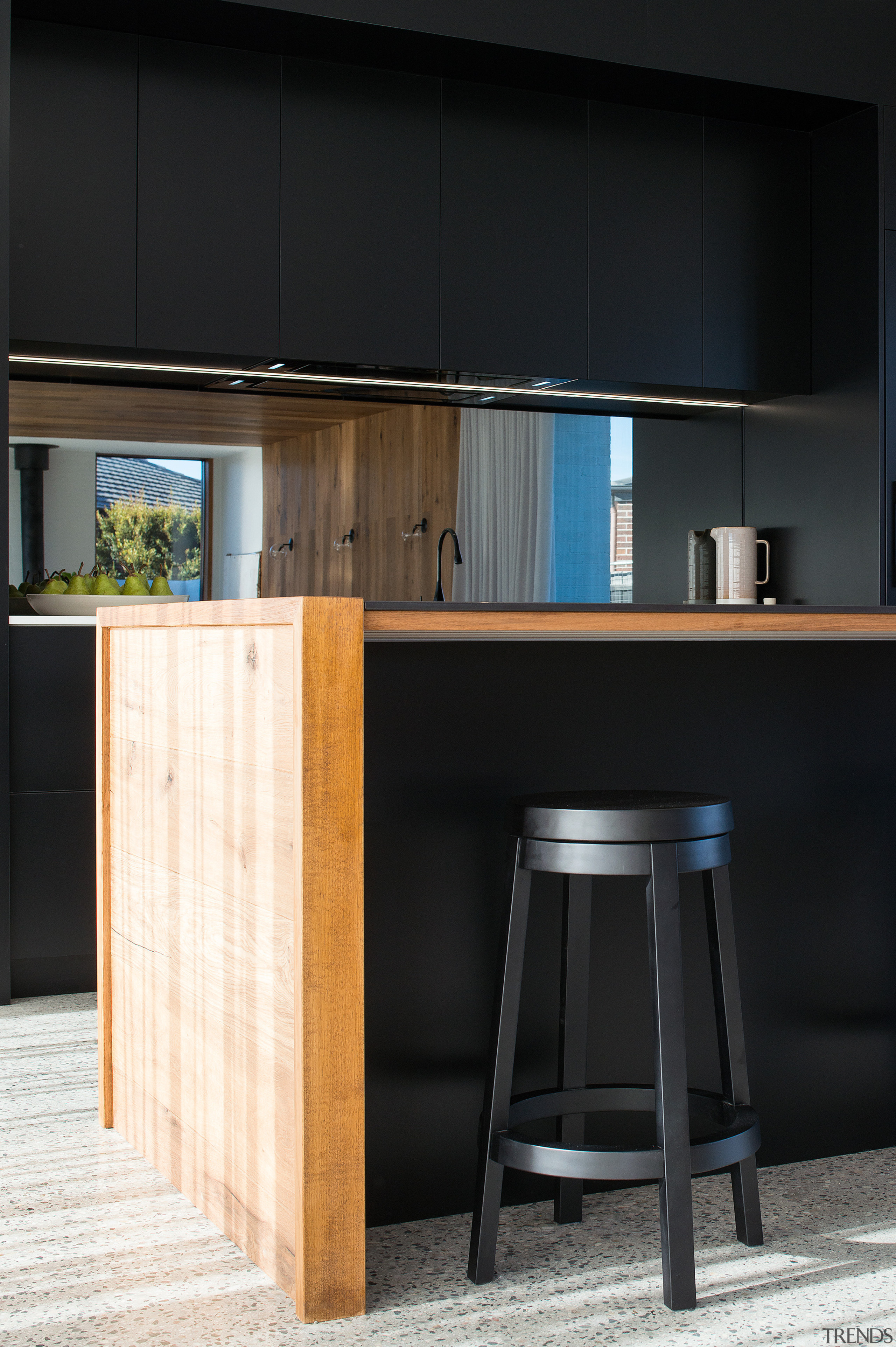 ​​​​​​​Mirror splashbacks add to the sense of space architecture, bar stool, kitchen, timber, glass splashback, stool, table, wood, wood stain, black, impact kitchens