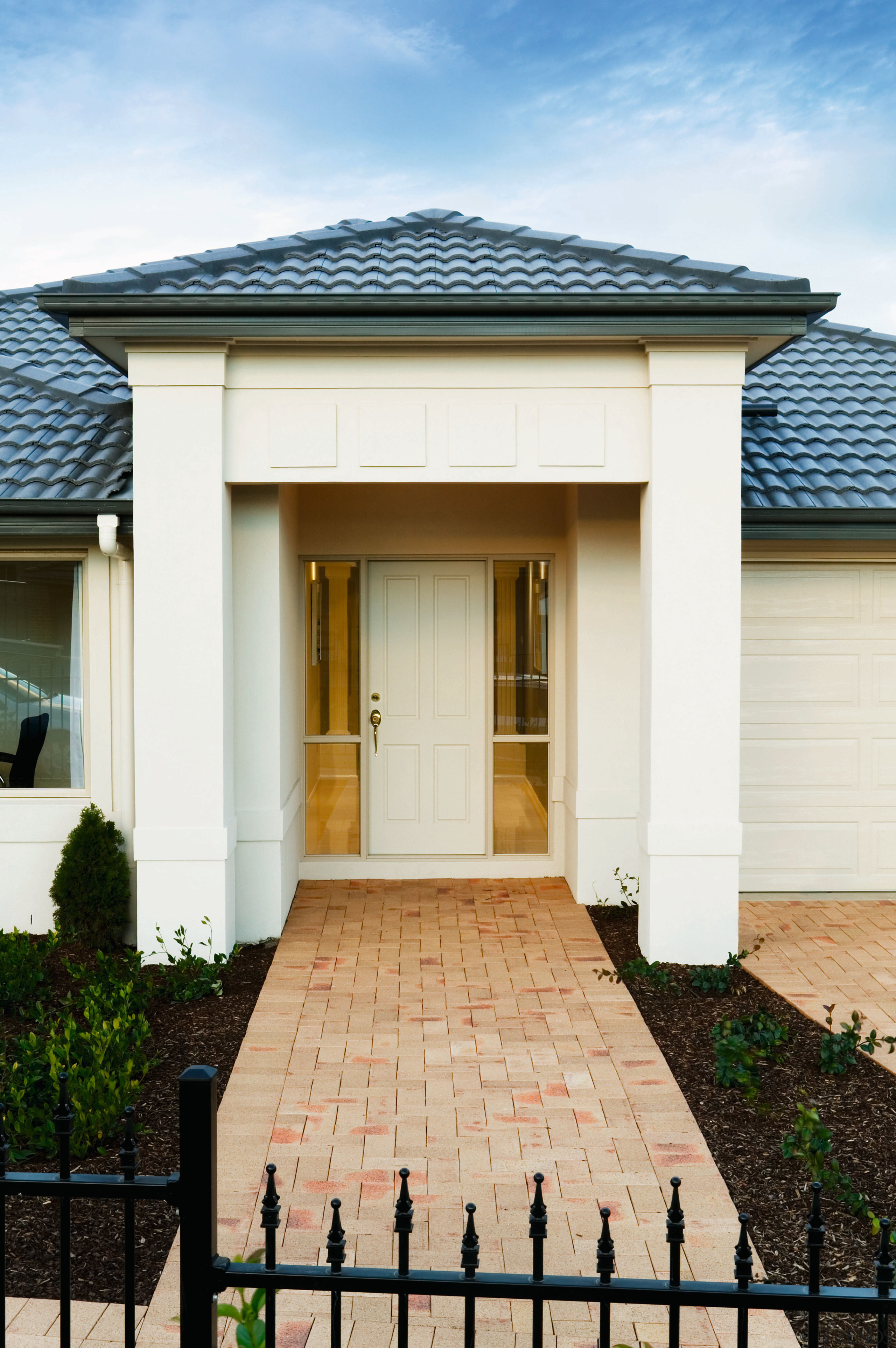 view of the new domiane home avoca featuring architecture, building, door, estate, facade, home, house, outdoor structure, property, real estate, residential area, roof, siding, window, white