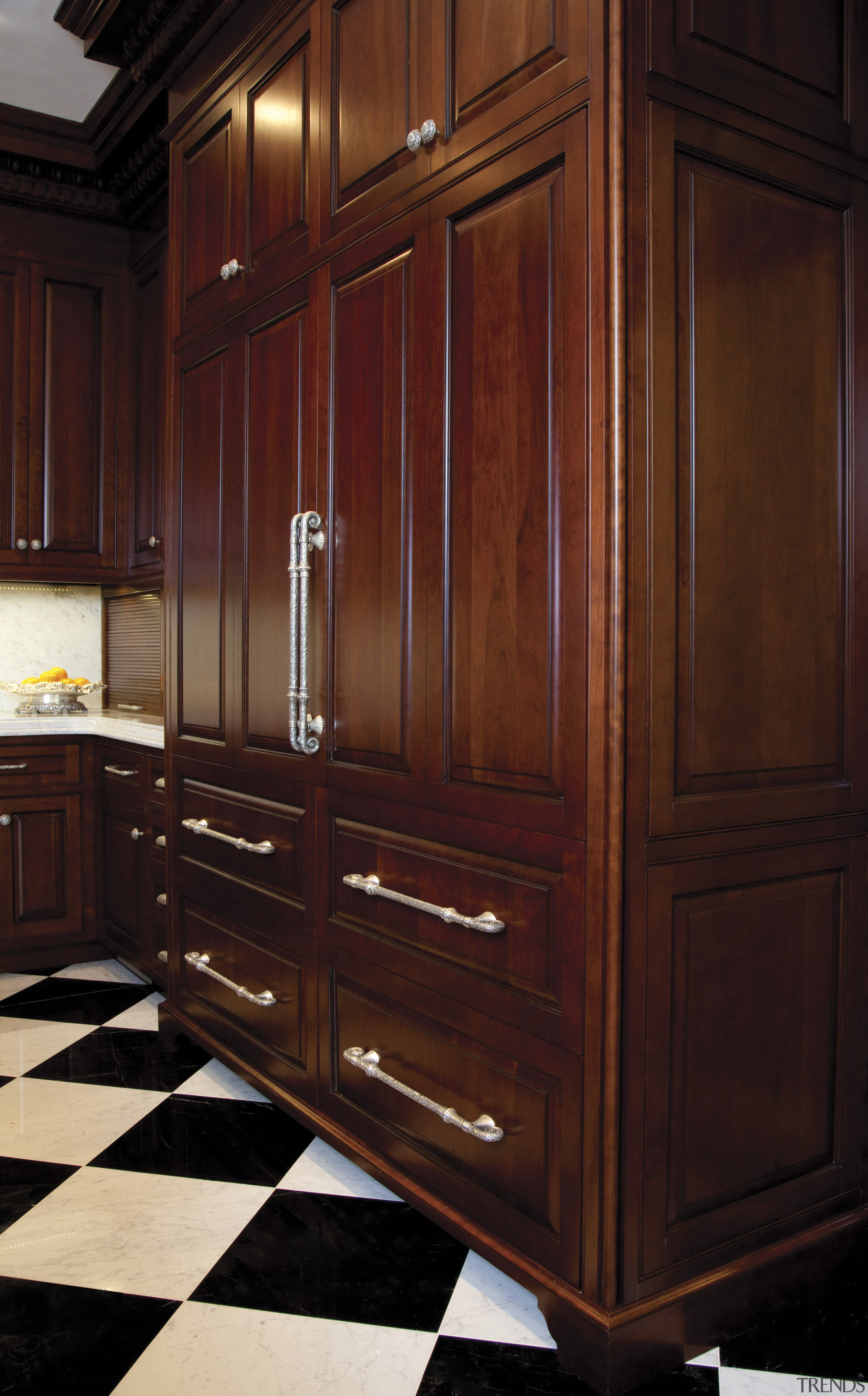 In this kitchen remodel, low-set drawers contain pots cabinetry, chest of drawers, closet, countertop, cupboard, drawer, furniture, hardwood, kitchen, room, wardrobe, wood, wood stain, red