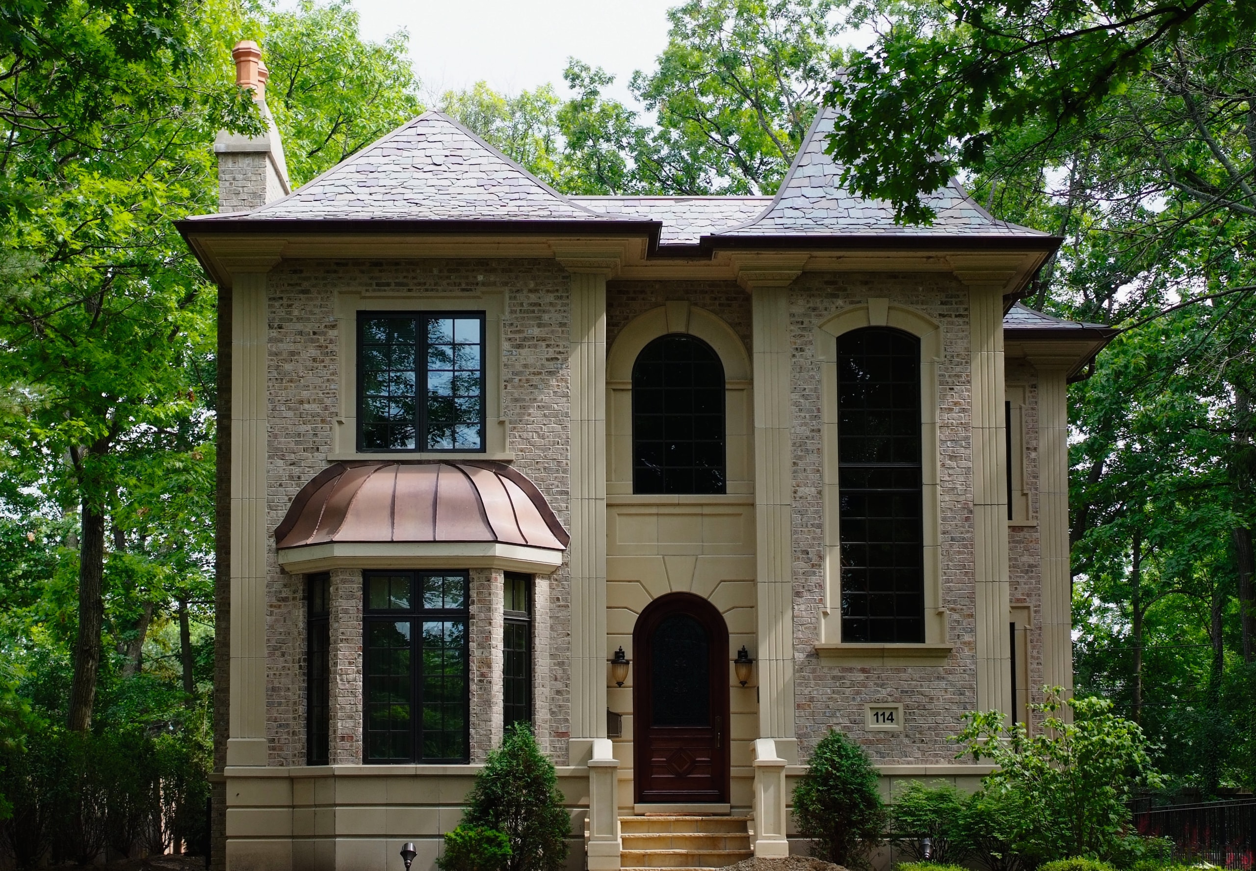 Located in Chicago's North Shore, this house was building, cottage, estate, facade, historic house, home, house, mansion, outdoor structure, property, real estate, tree, window, green