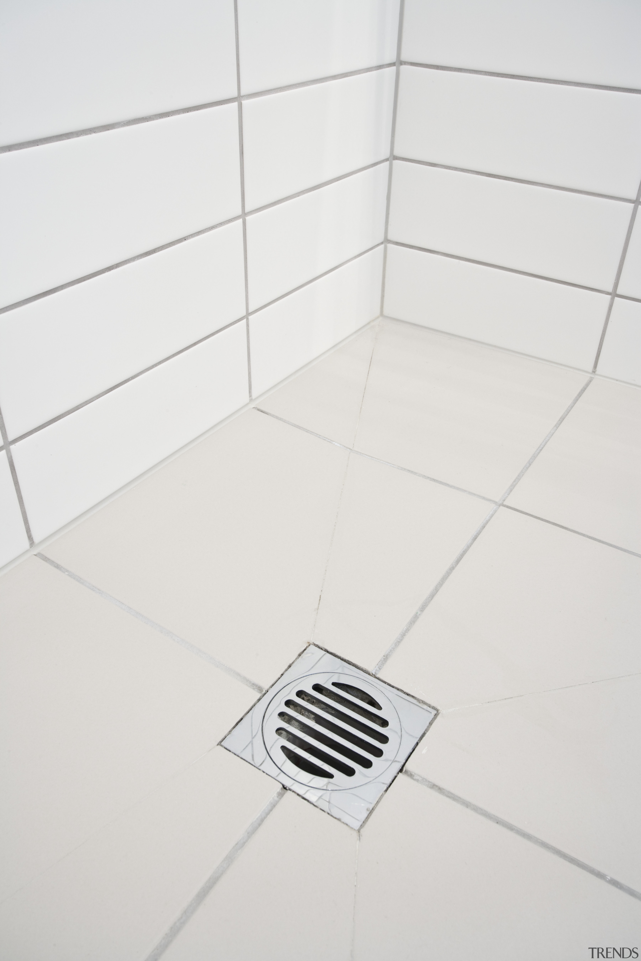 internal bathroom view of drainage solutions at Chews angle, floor, line, plumbing fixture, product, product design, tile, white